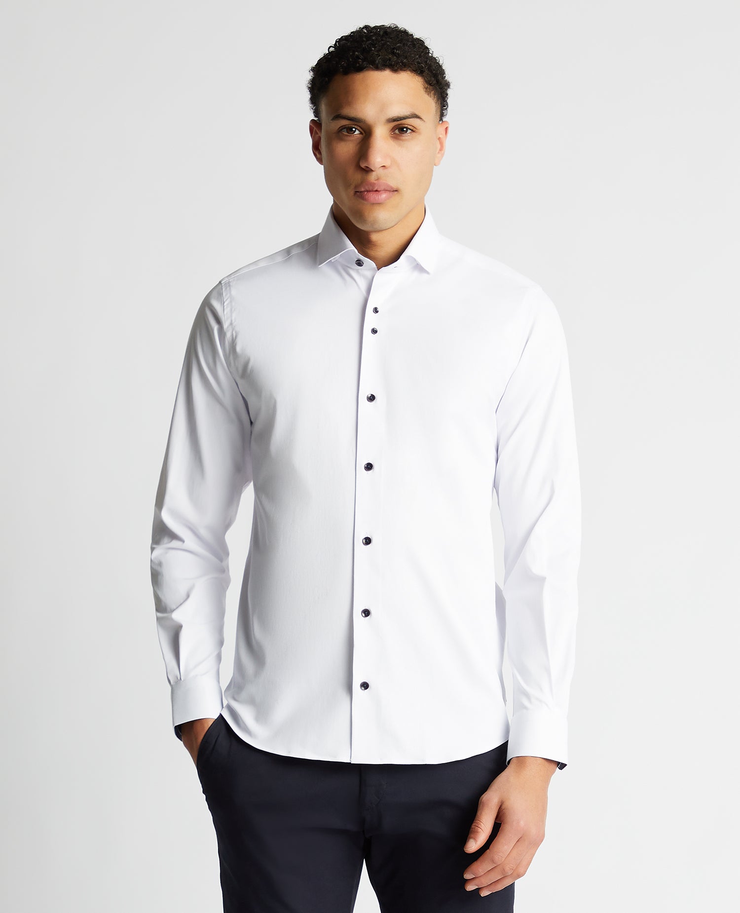 Man wearing a white Tapered Fit Cotton-Blend Stretch Shirt