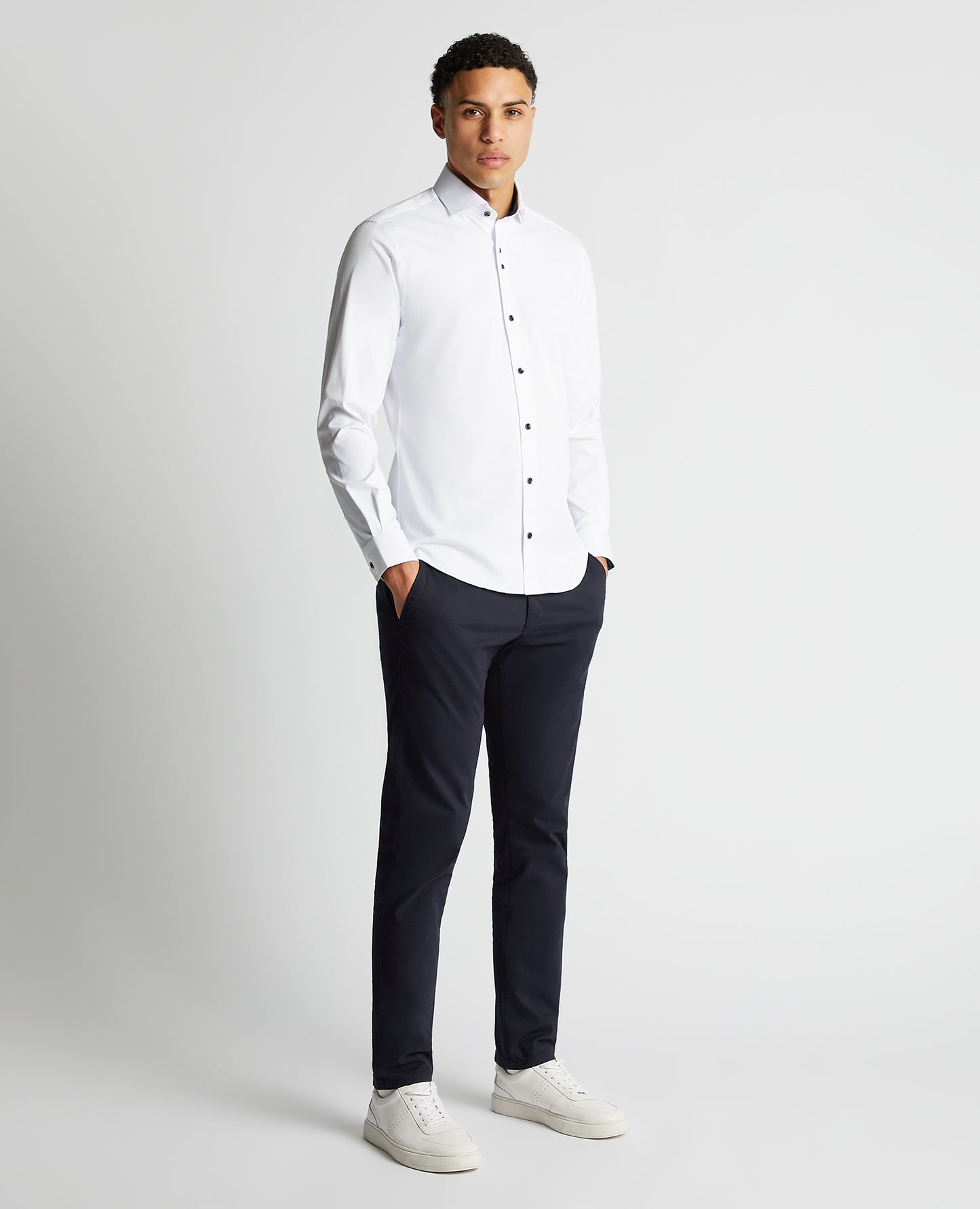 Man wearing a white Tapered Fit Cotton-Blend Stretch Shirt