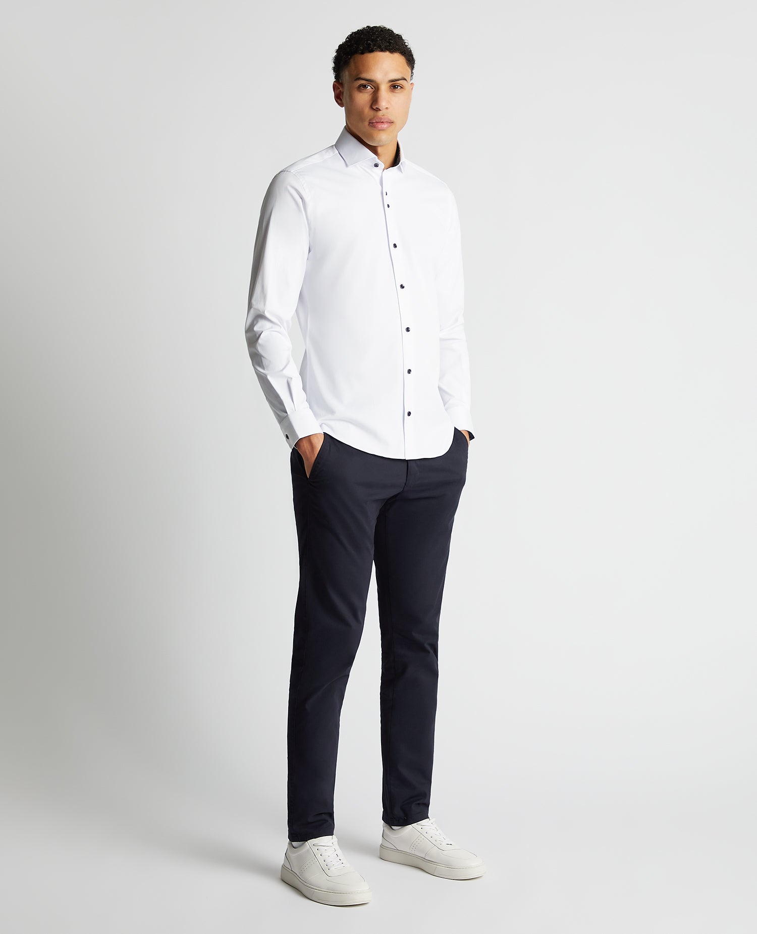 Man wearing a white Tapered Fit Cotton-Blend Stretch Shirt
