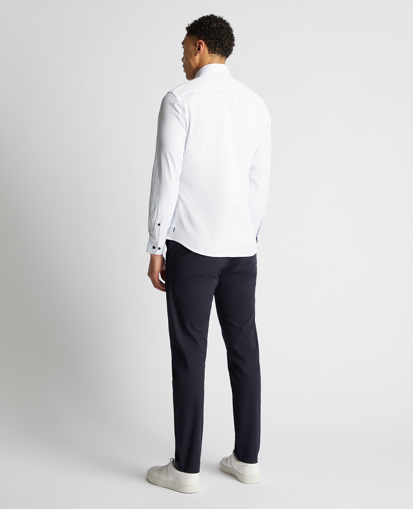 Man wearing a white Tapered Fit Cotton-Blend Stretch Shirt