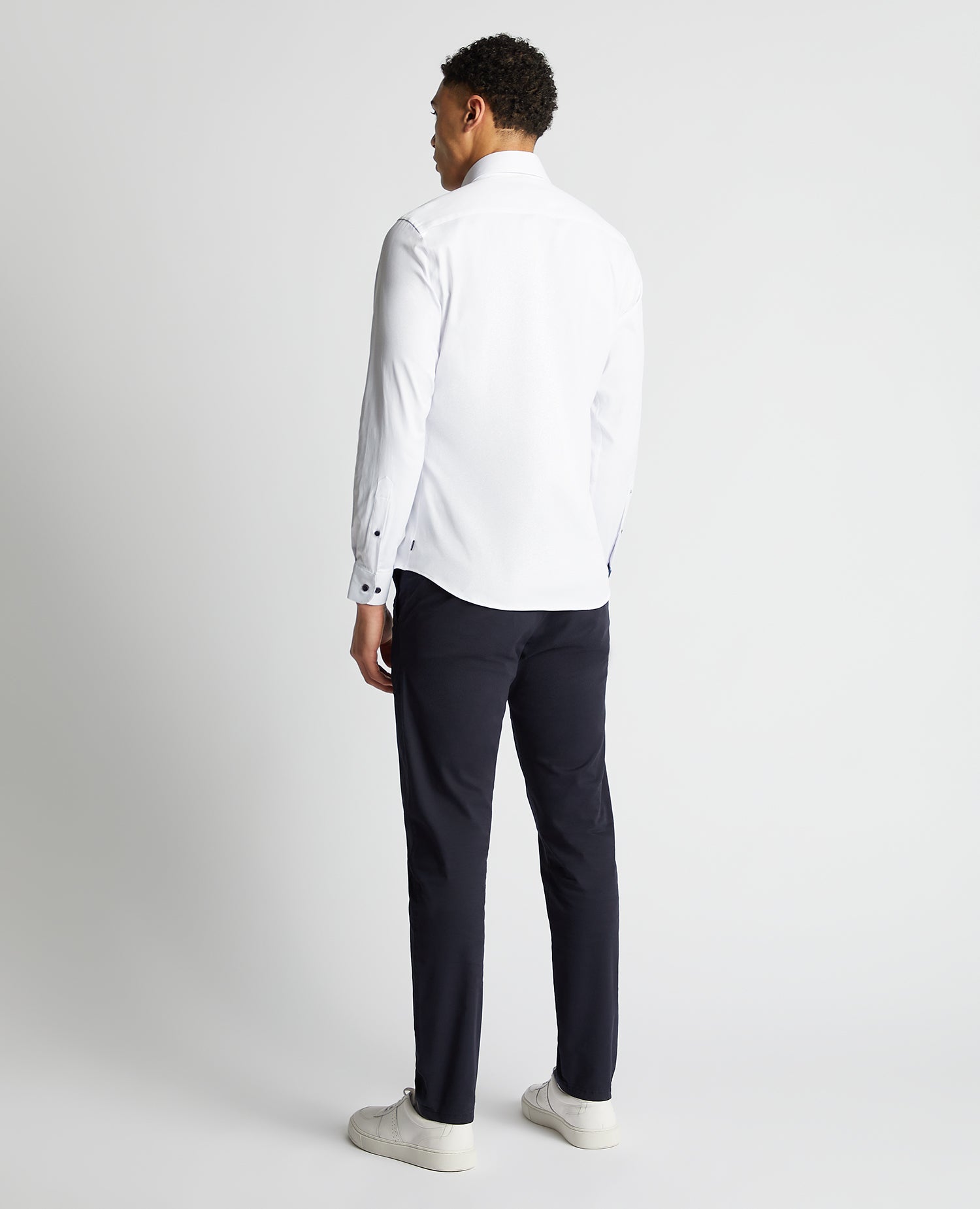 Man wearing a white Tapered Fit Cotton-Blend Stretch Shirt