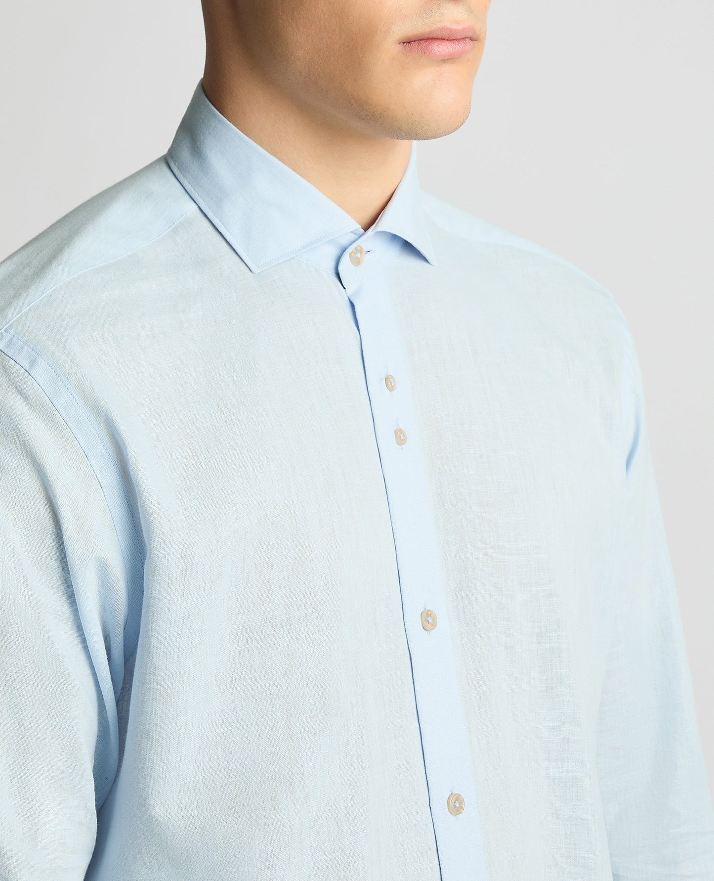 Man wearing a blue Tapered Fit Cotton-Linen Blend Shirt