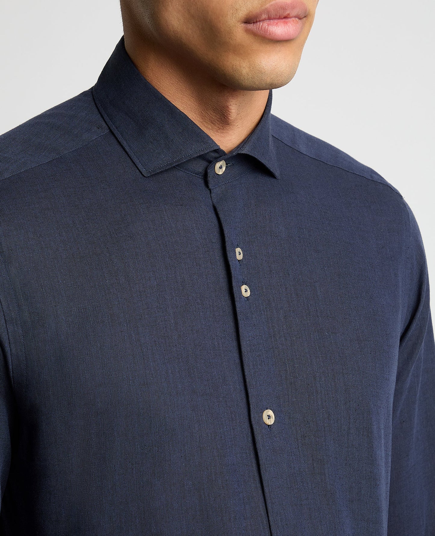Man wearing a navy Tapered Fit Cotton-Linen Blend Shirt
