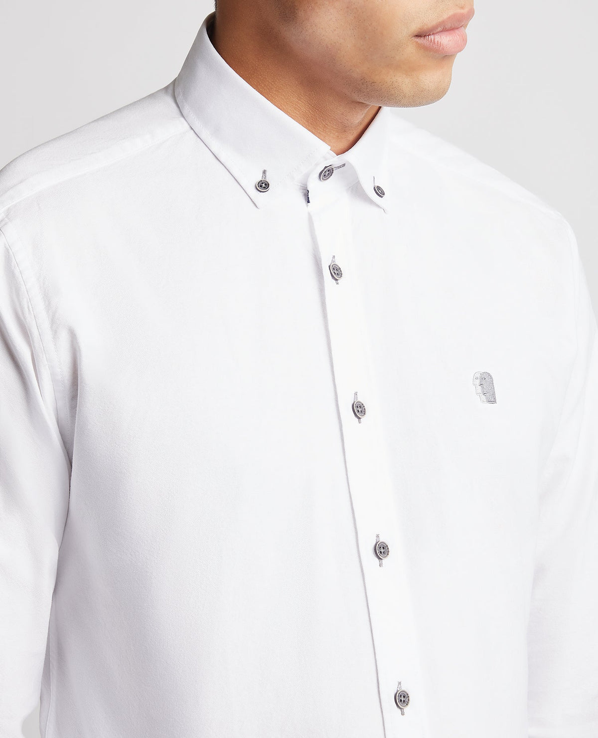 Man wearing a white Tapered Fit Oxford Cotton Shirt