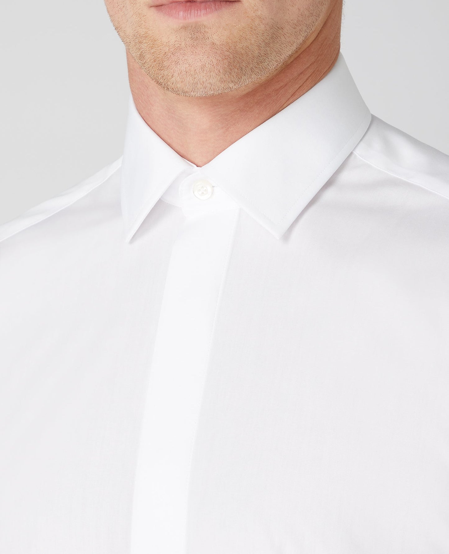 Man wearing a white Tapered Fit Cotton-Blend Shirt