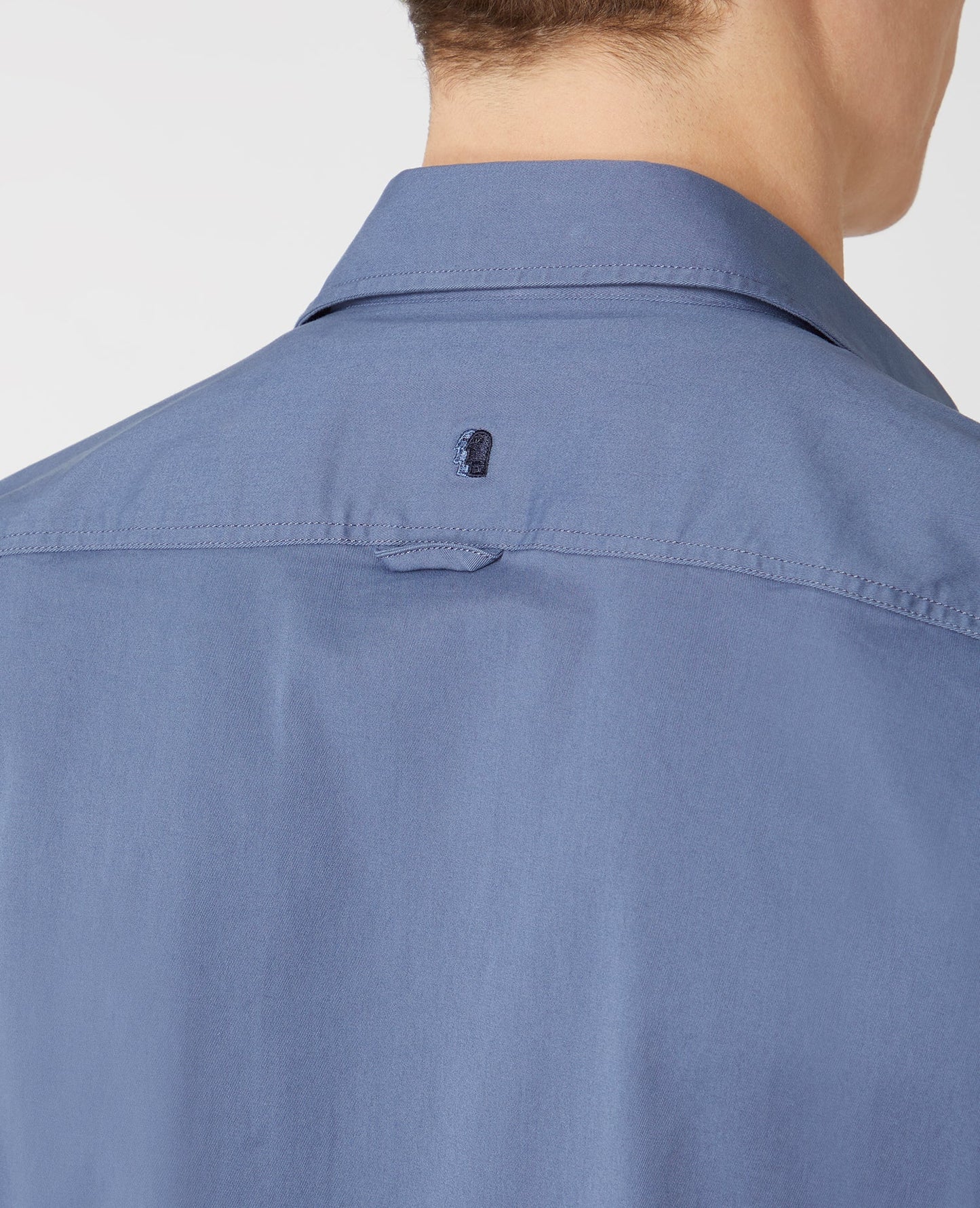 Man wearing a blue Tapered Fit Cotton Stretch Shirt