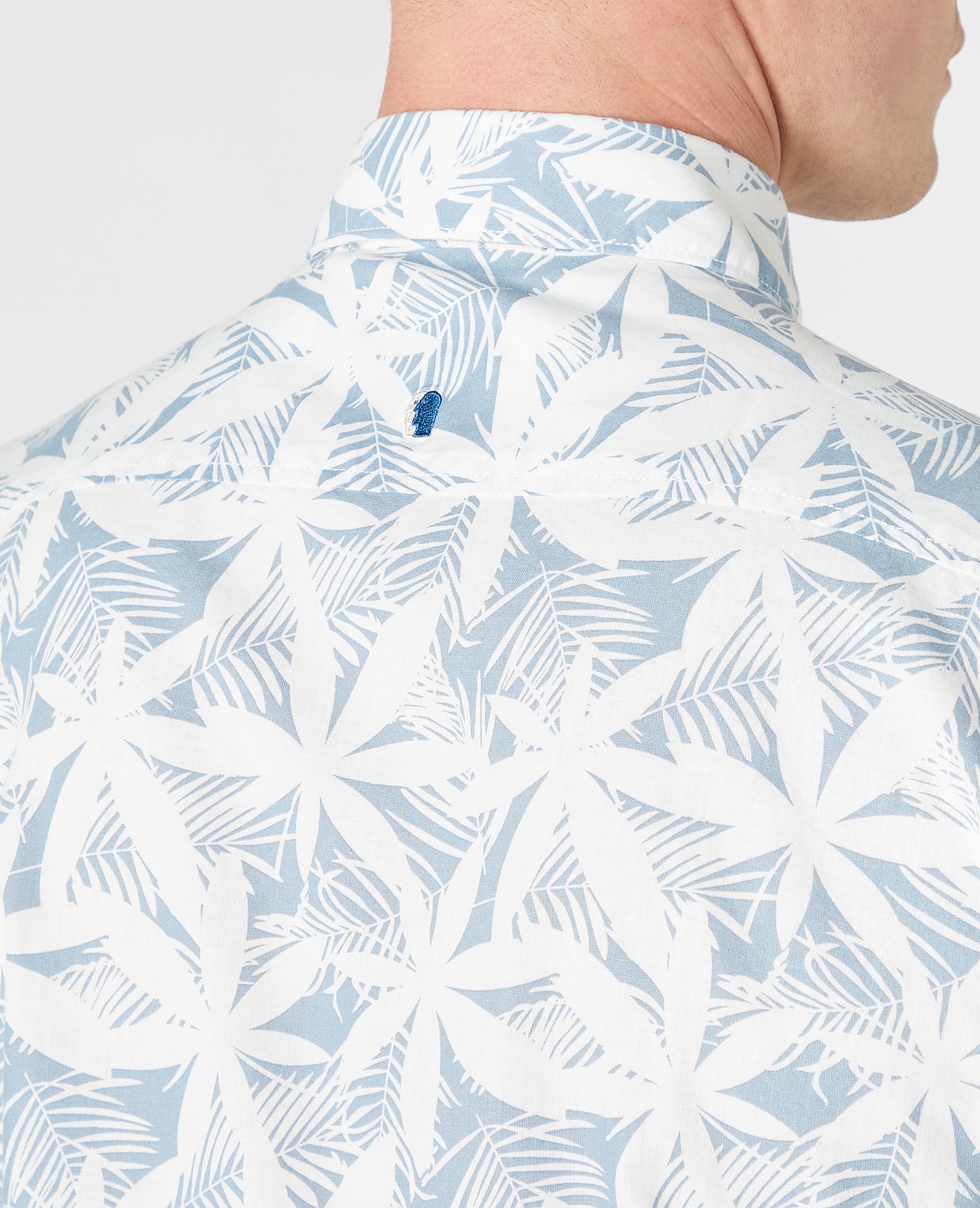 Man wearing a blue Tapered Fit Print Cotton Short Sleeve Shirt