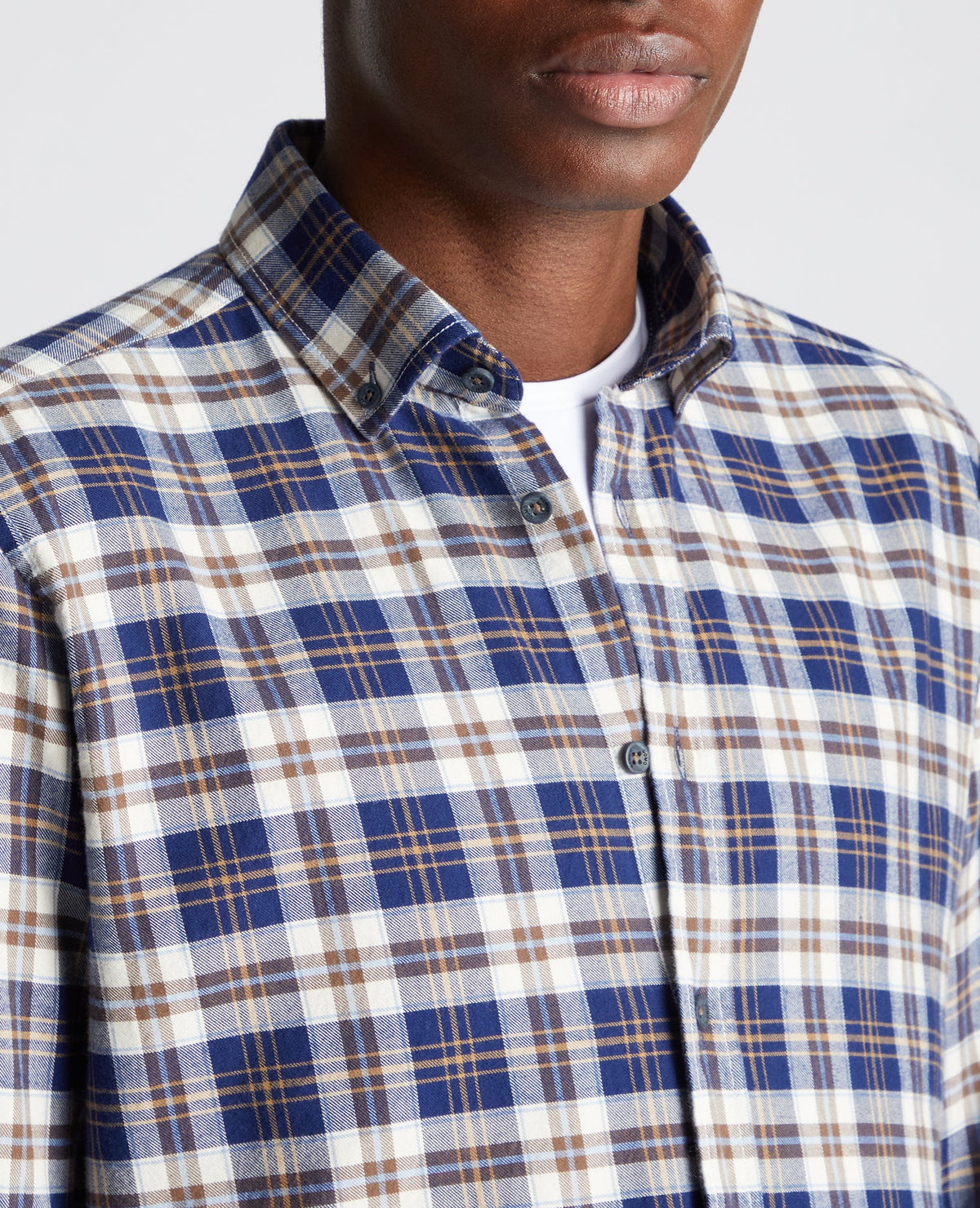 Man wearing a blue Tapered Fit Checked Cotton Shirt