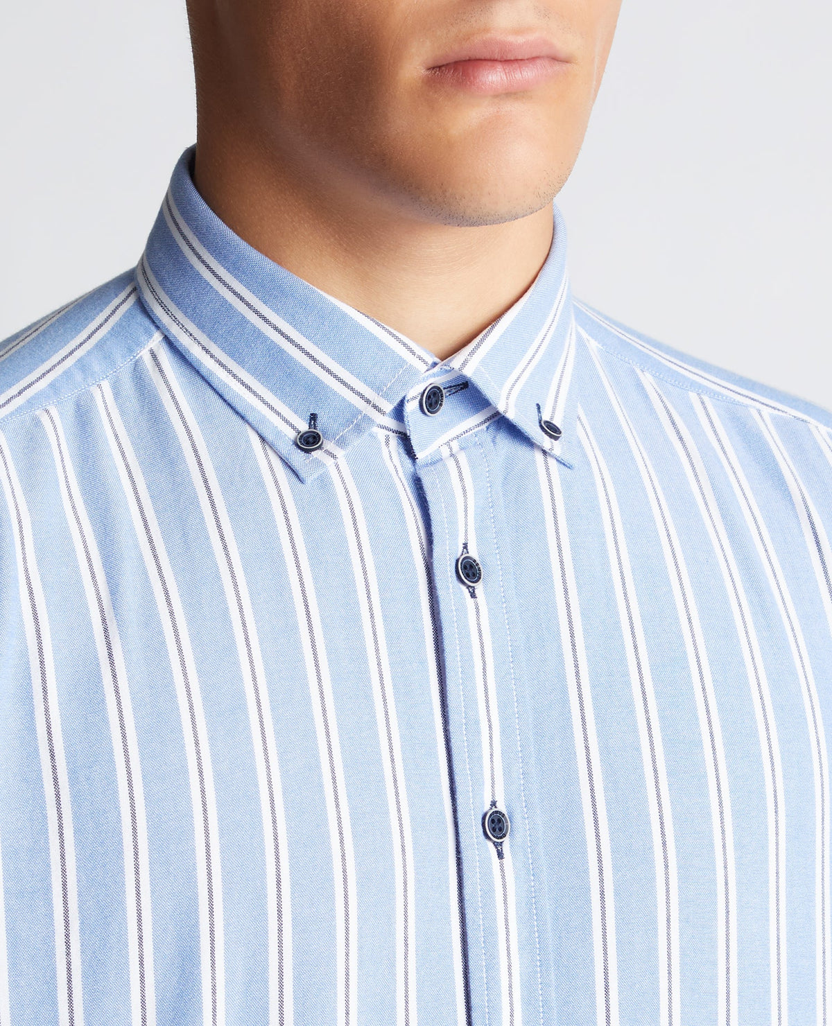 Man wearing a blue Tapered Fit Striped Cotton Shirt