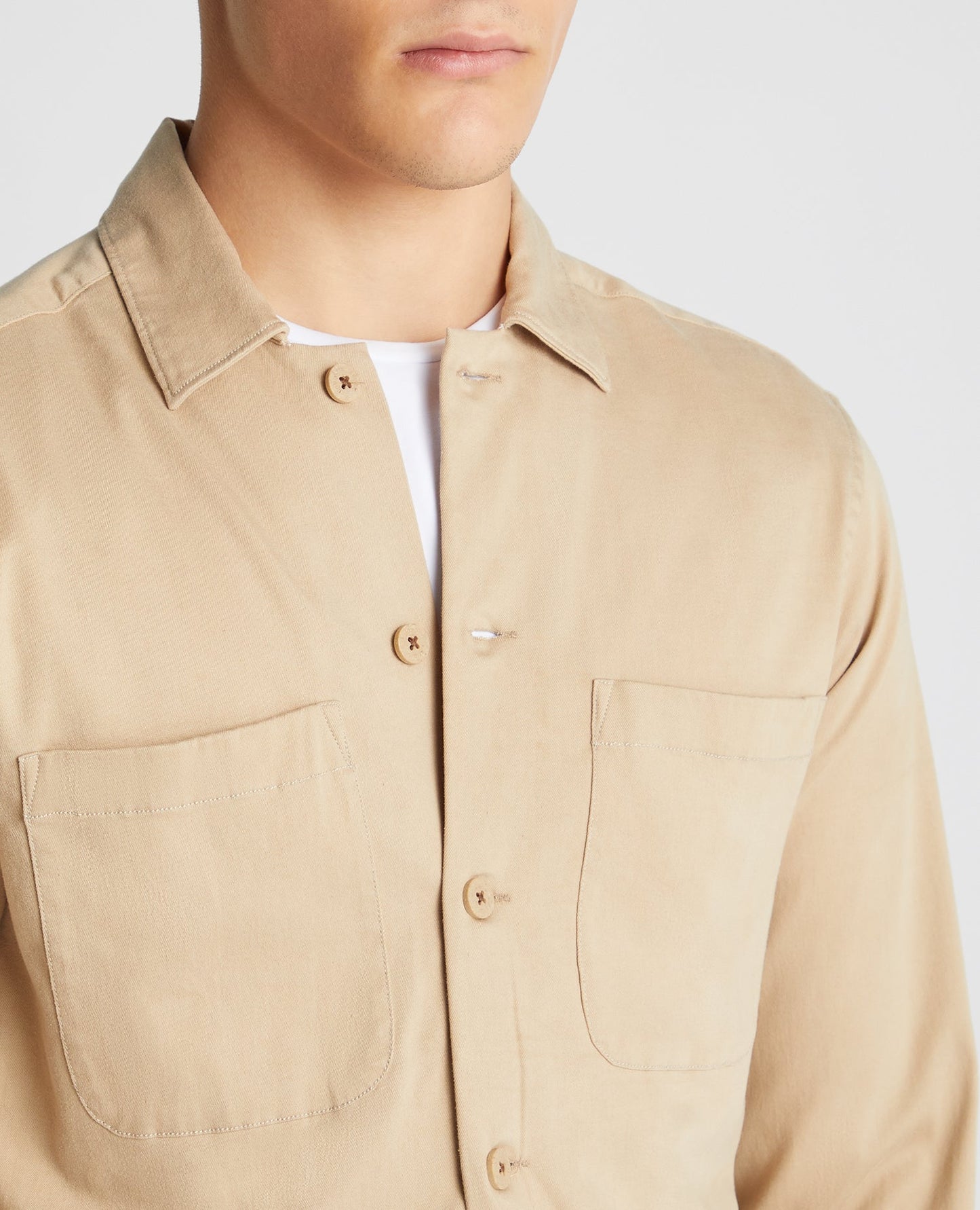 Man wearing a sand Tapered Fit Long Sleeve Tencel Overshirt