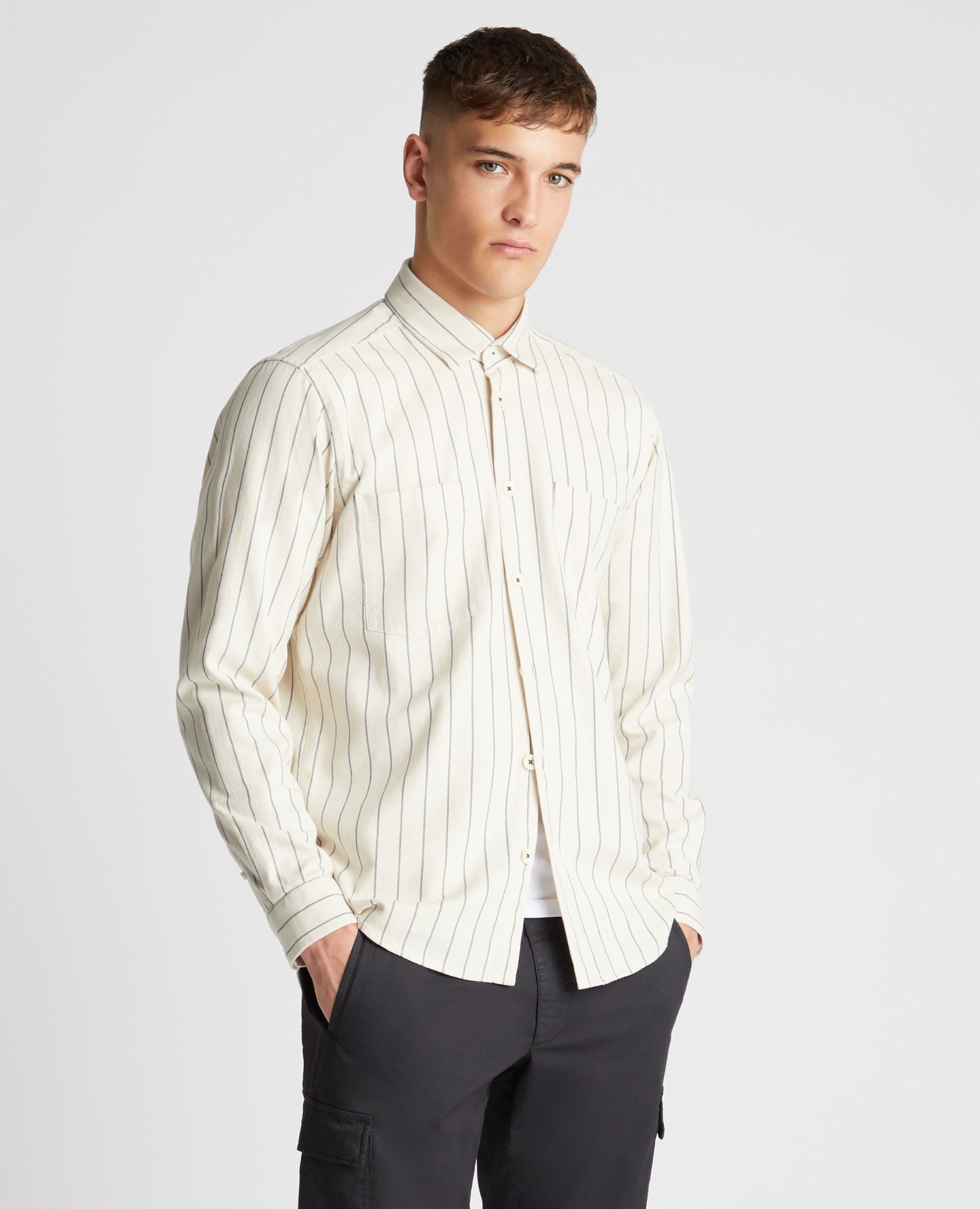 Man wearing a sand Tapered Fit Cotton Linen Mix Pinstripe Overshirt