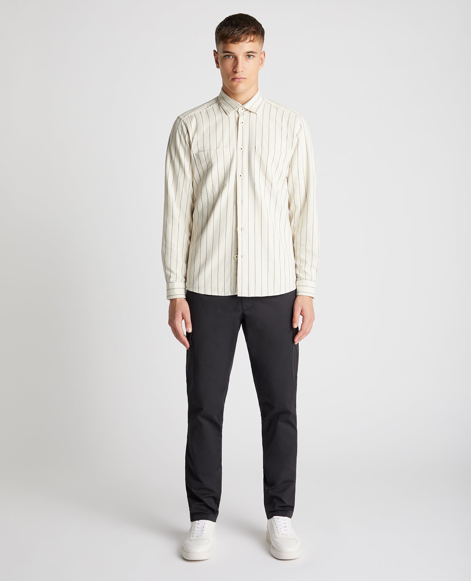 Man wearing a sand Tapered Fit Cotton Linen Mix Pinstripe Overshirt