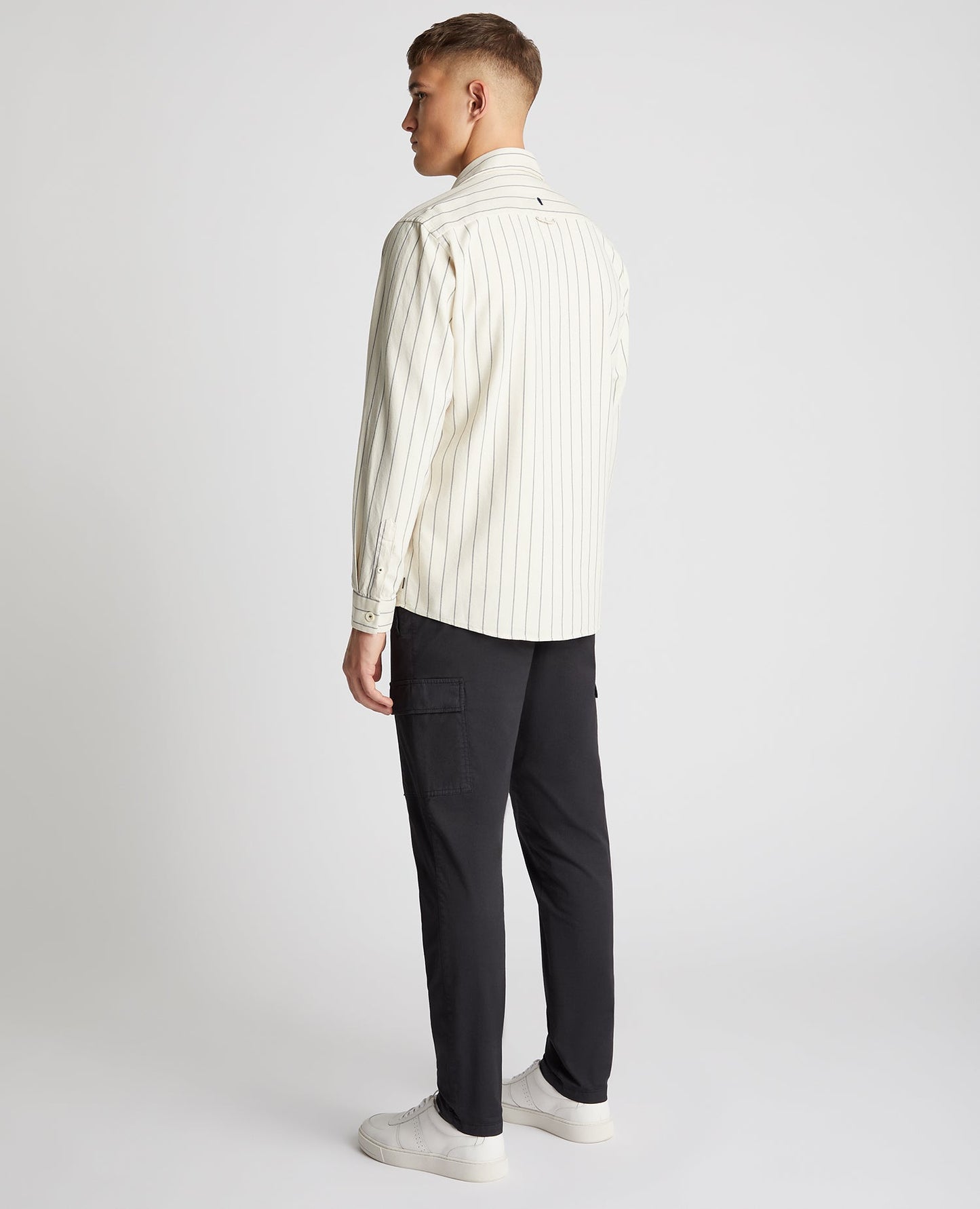 Man wearing a sand Tapered Fit Cotton Linen Mix Pinstripe Overshirt