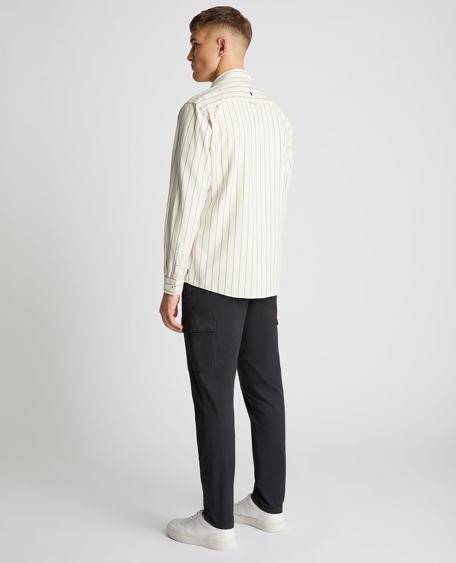 Man wearing a sand Tapered Fit Cotton Linen Mix Pinstripe Overshirt