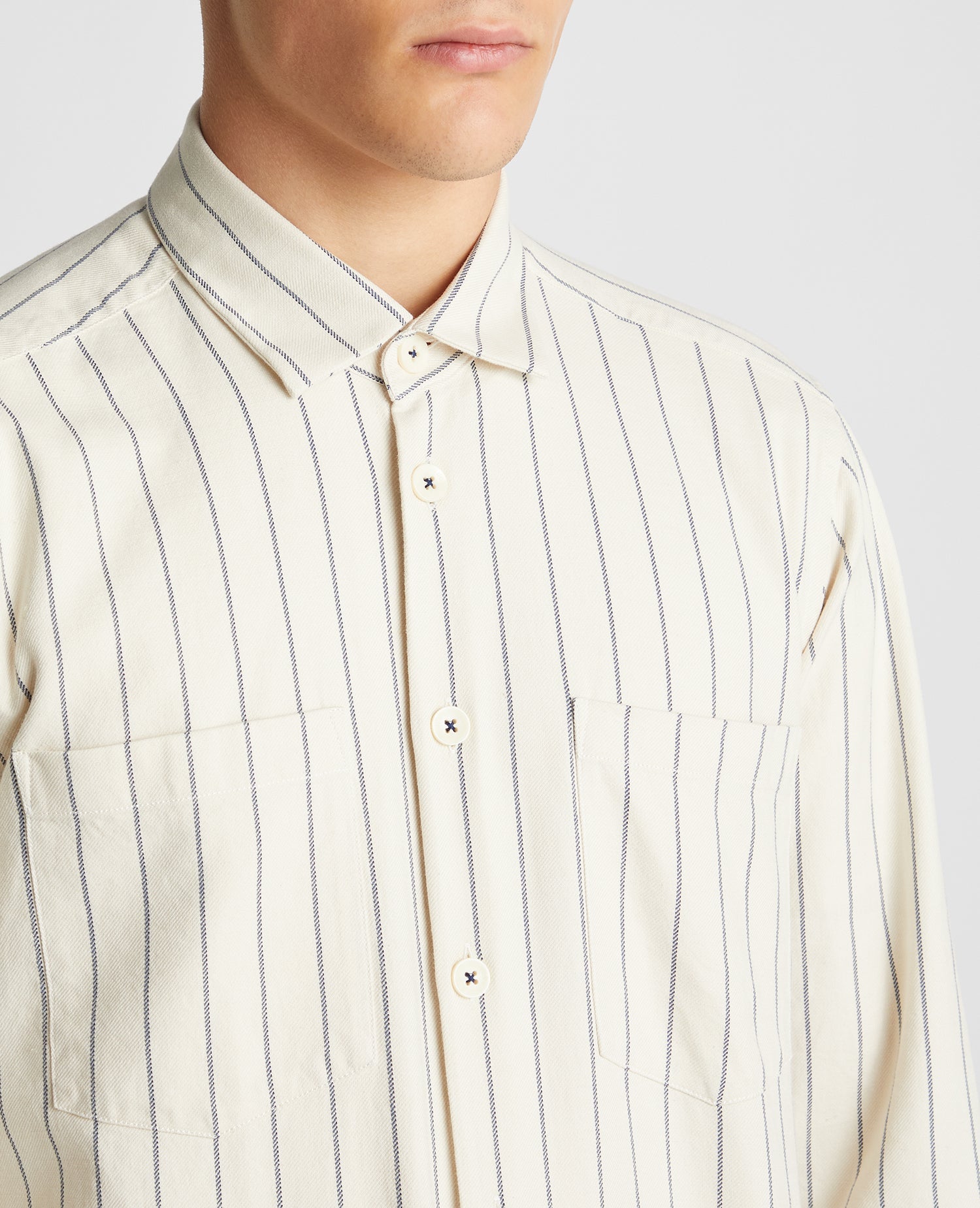 Man wearing a sand Tapered Fit Cotton Linen Mix Pinstripe Overshirt