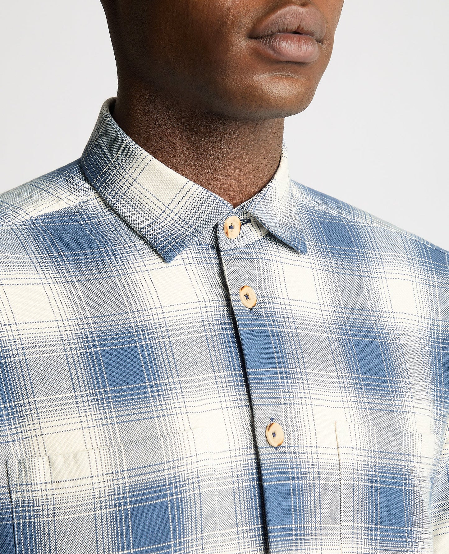 Man wearing a blue Tapered Fit Long Sleeve Checked Shirt