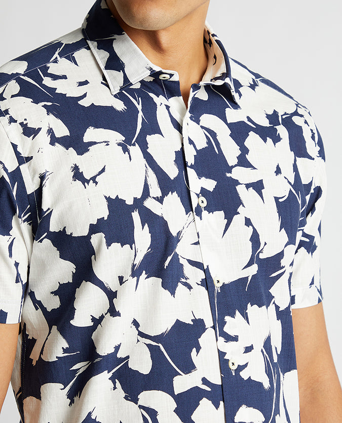 Man wearing a navy Tapered Fit Cotton Short Sleeve Print Shirt
