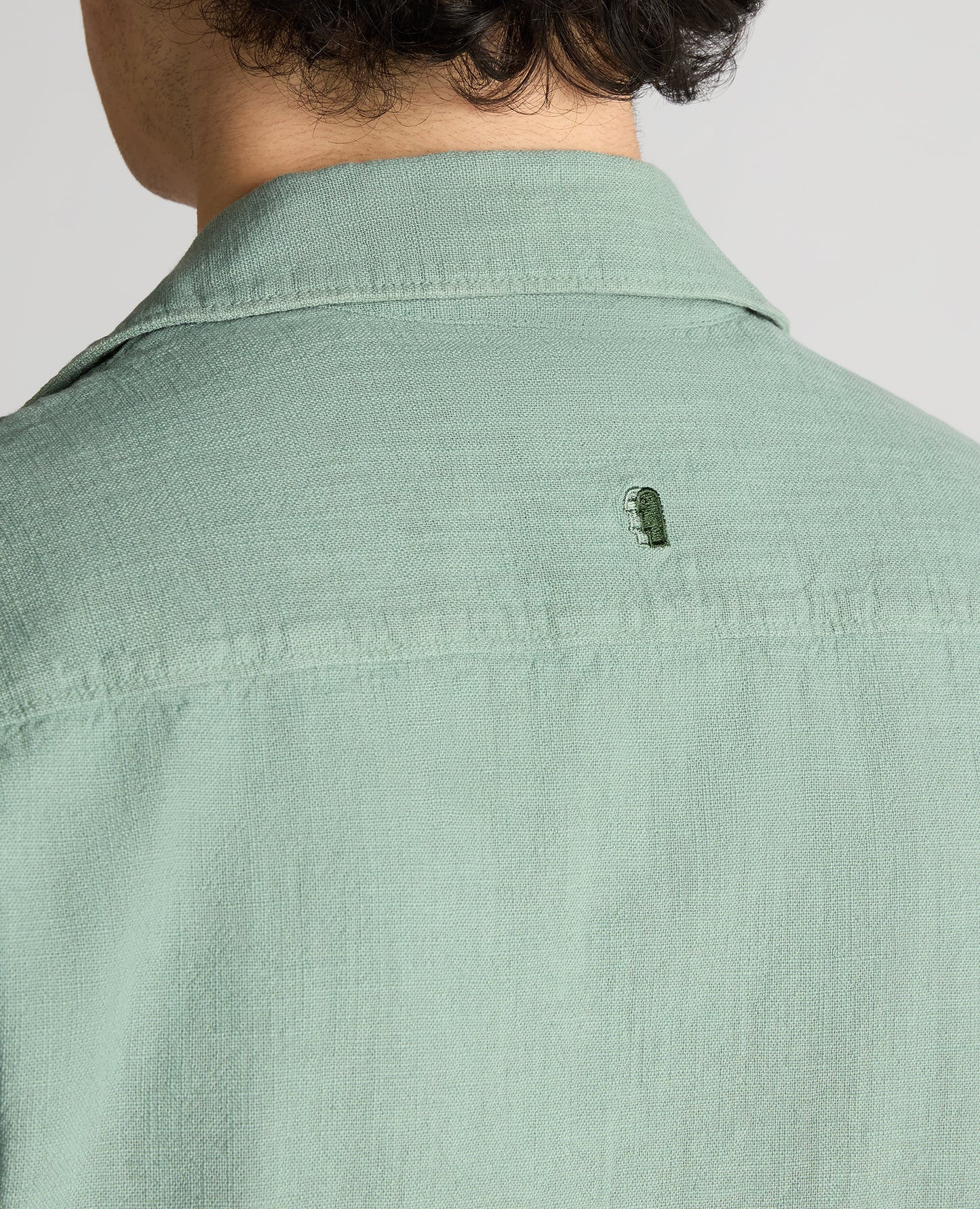 Man wearing a green Tapered Fit Cotton-Linen Shirt