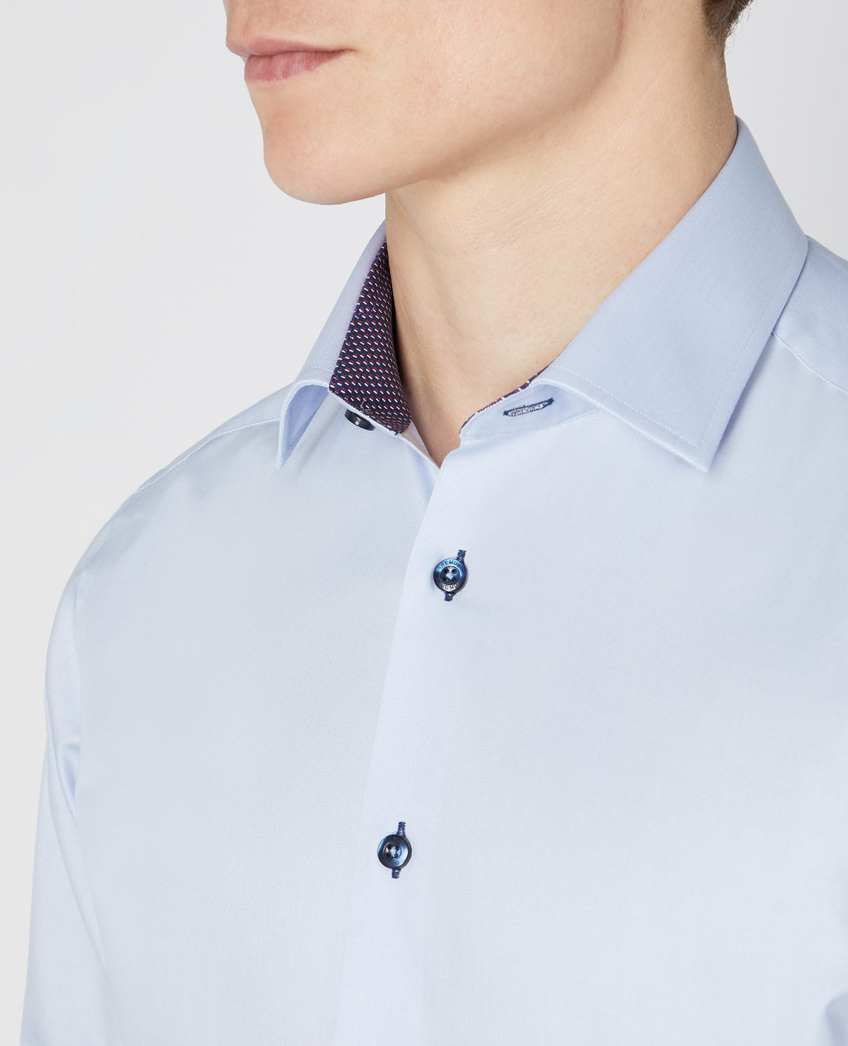 Man wearing a blue Tapered Fit Cotton-Blend Satin Shirt