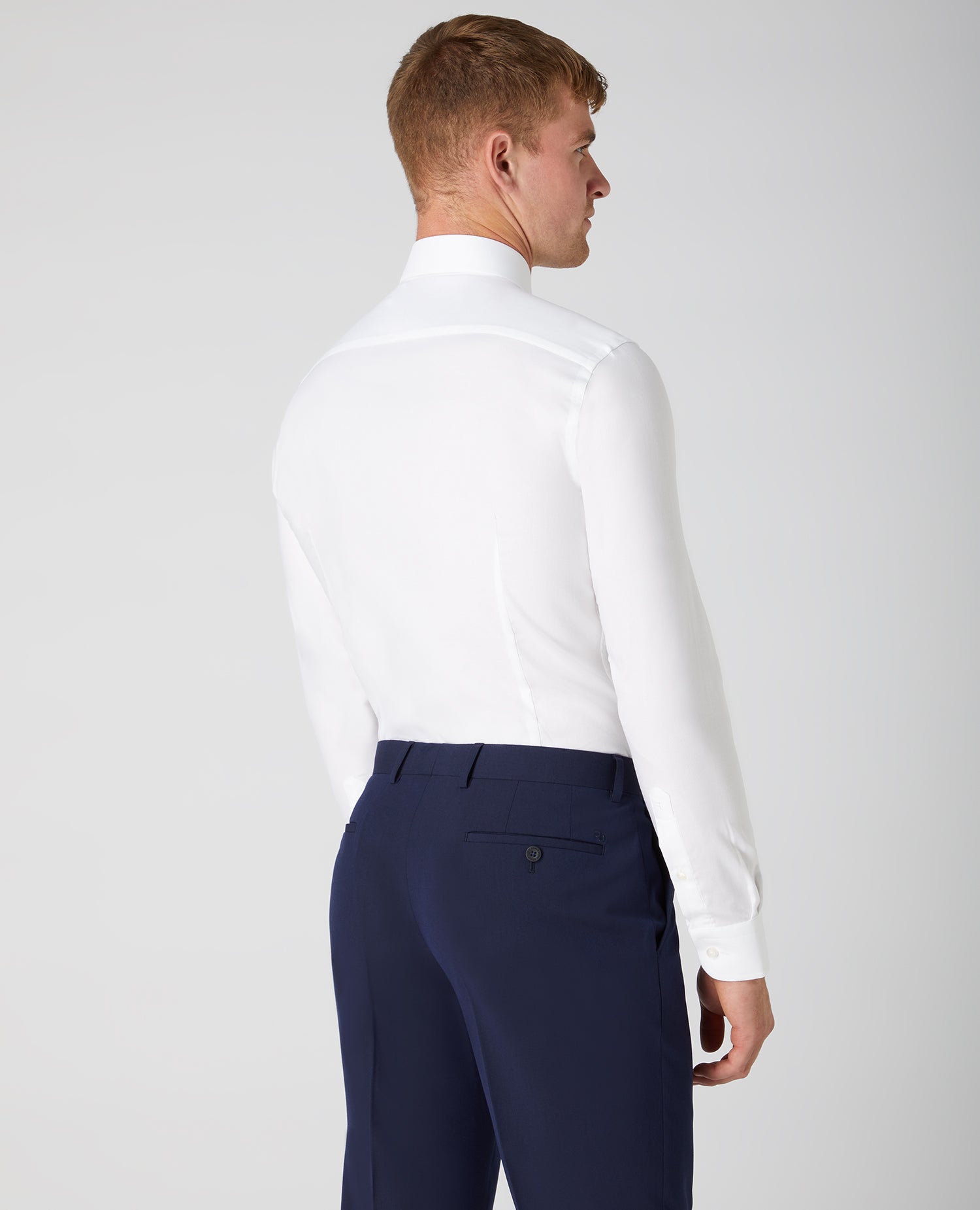 Man wearing a white Slim Fit Cotton Oxford Shirt