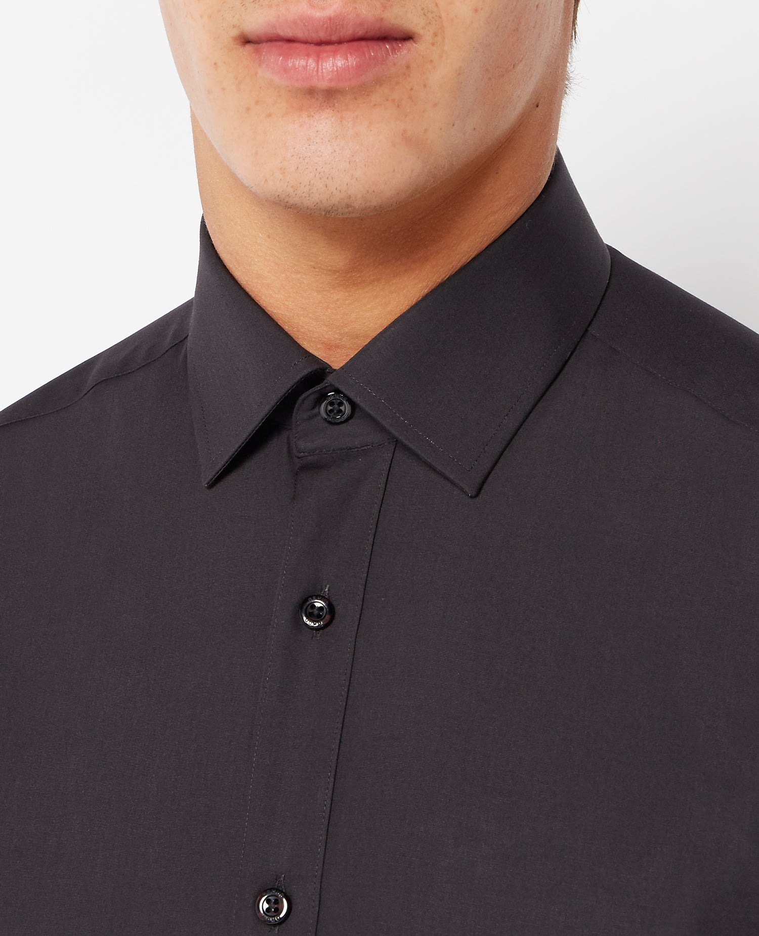 Man wearing a black Tapered Fit Cotton-Blend Shirt