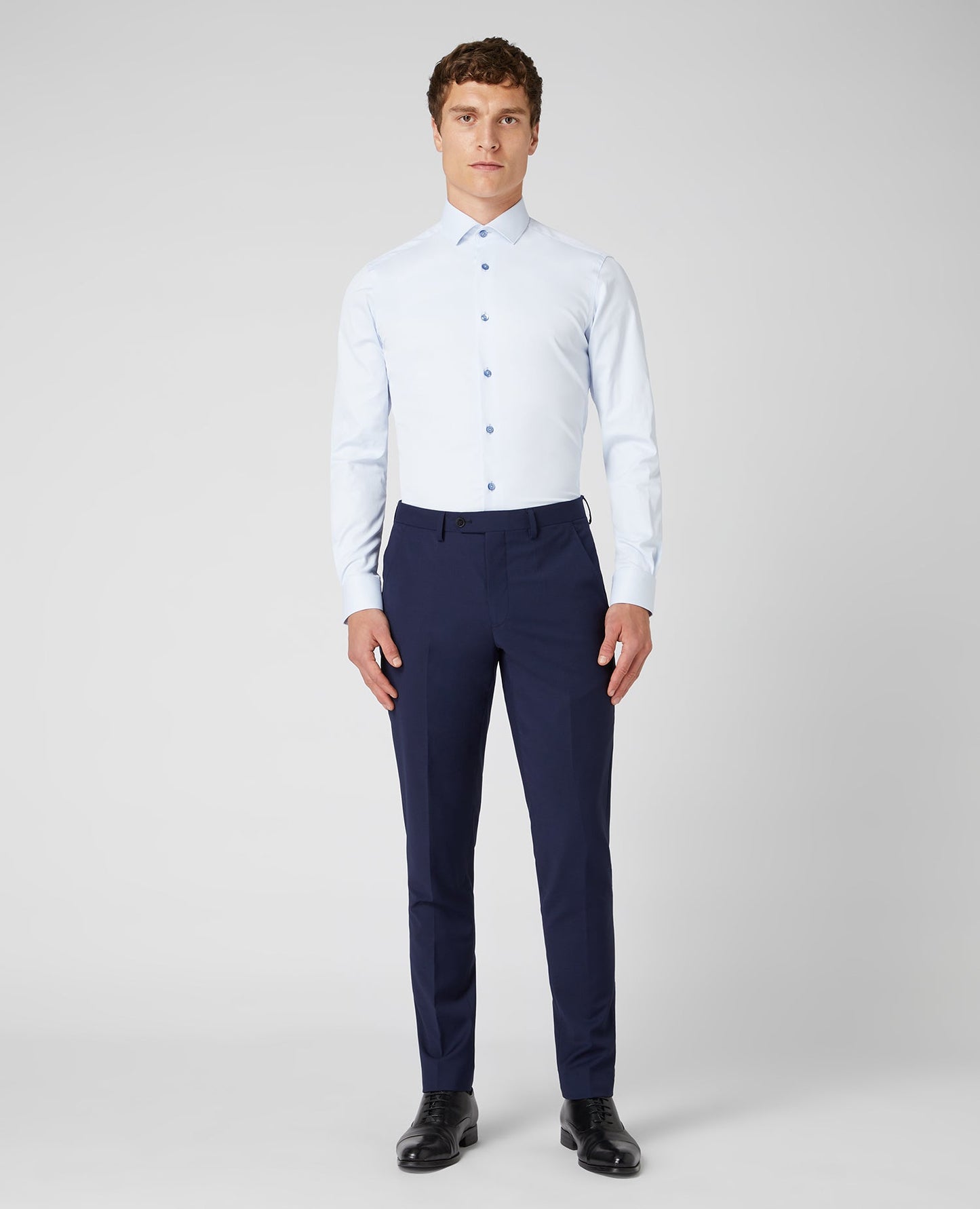 Man wearing a blue Slim Fit Cotton Stretch Shirt