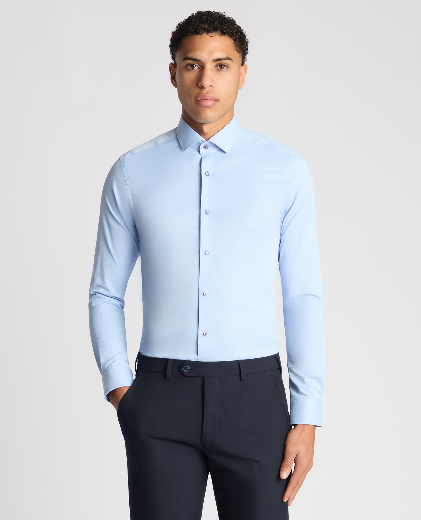 Man wearing a blue Slim Fit Cotton Stretch Shirt