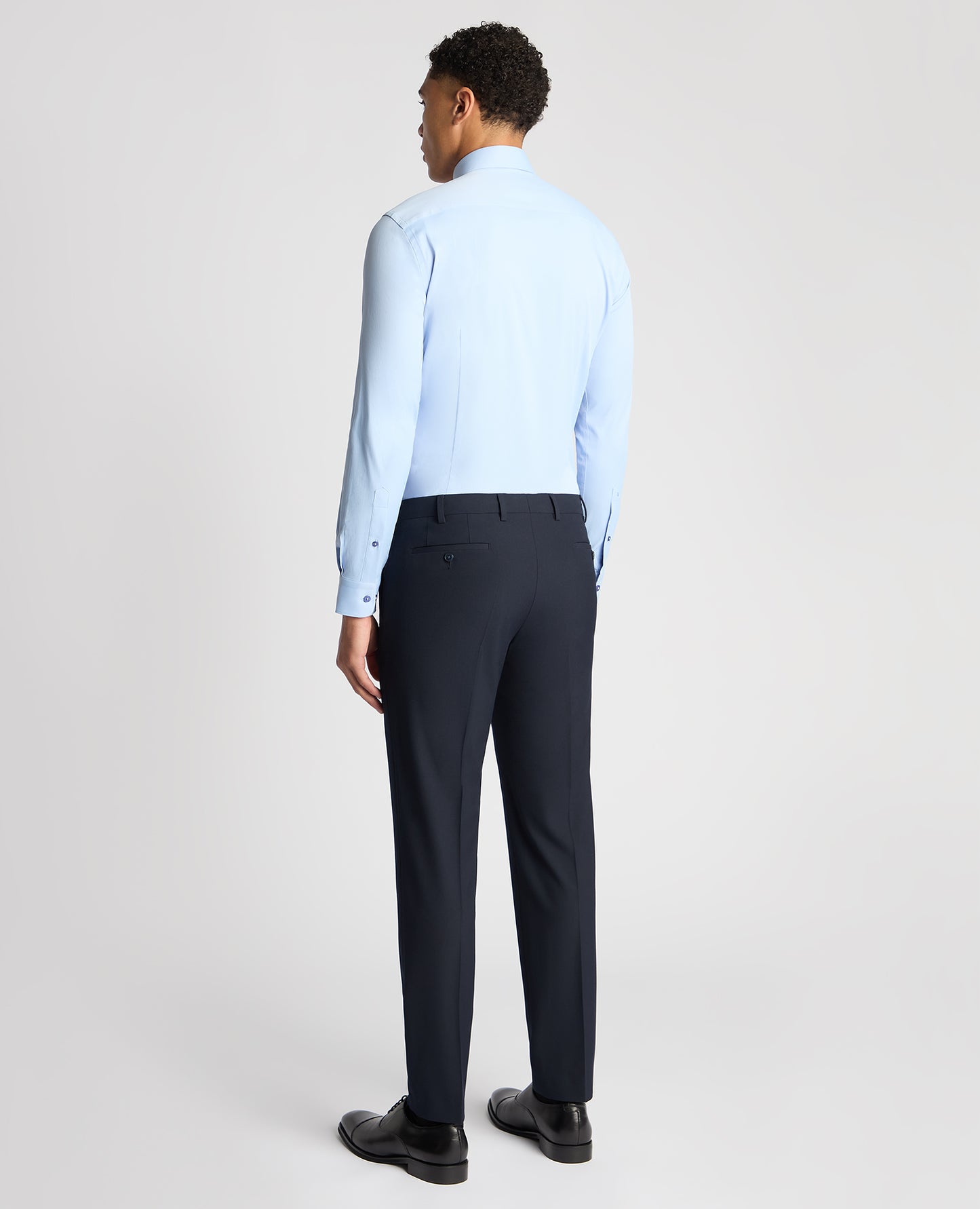 Man wearing a blue Slim Fit Cotton Stretch Shirt