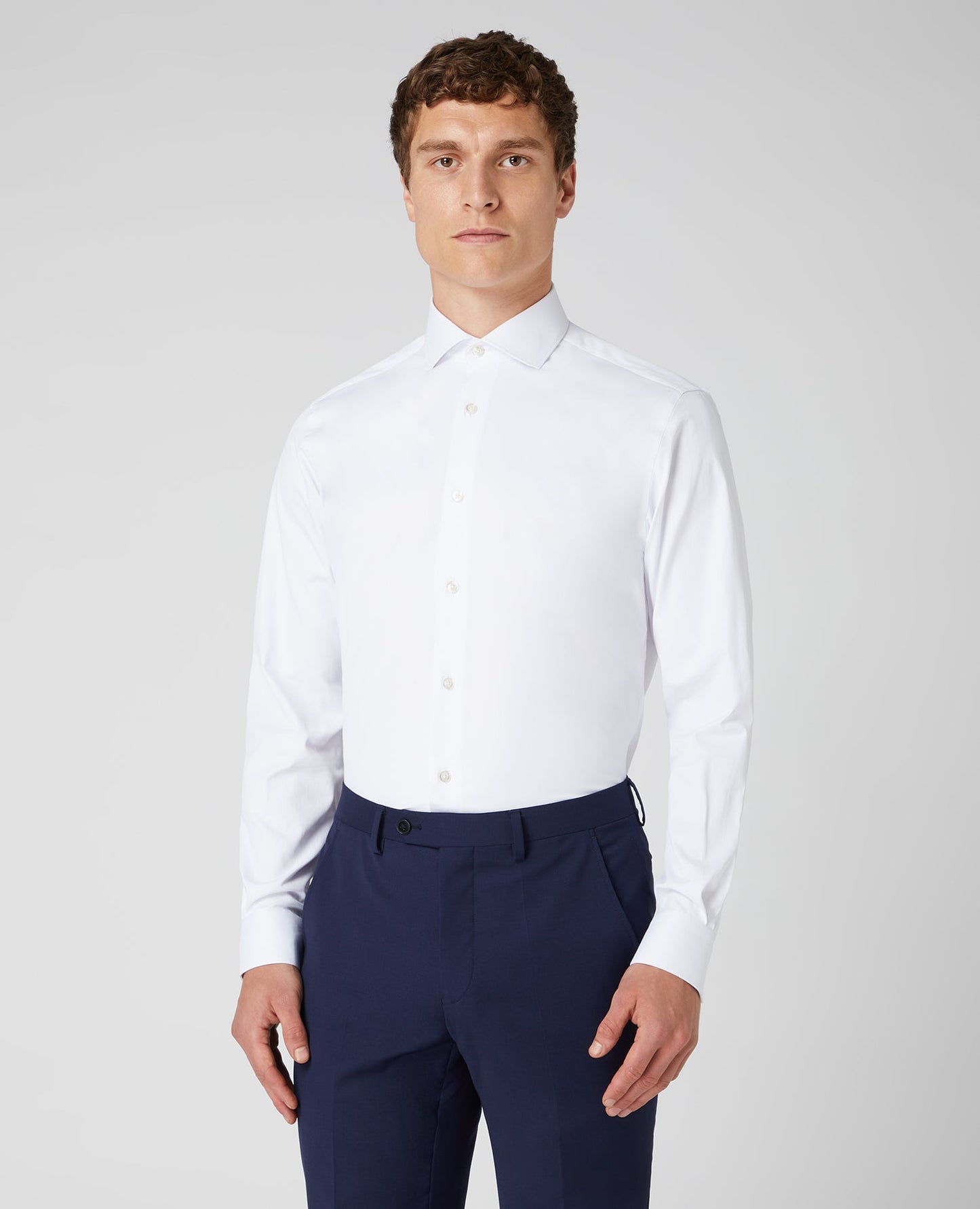 Man wearing a white Tapered Fit Cotton Stretch Shirt