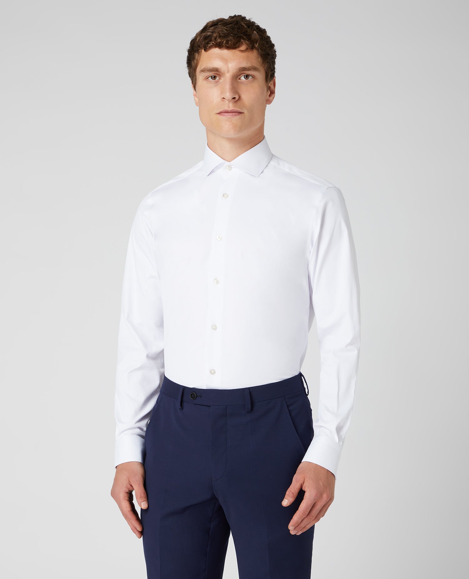 Man wearing a white Tapered Fit Cotton Stretch Shirt