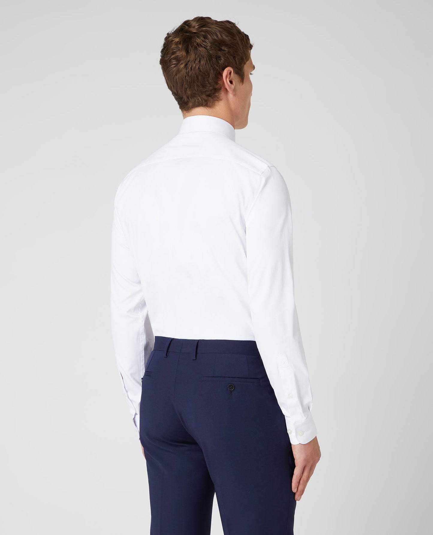 Man wearing a white Tapered Fit Cotton Stretch Shirt