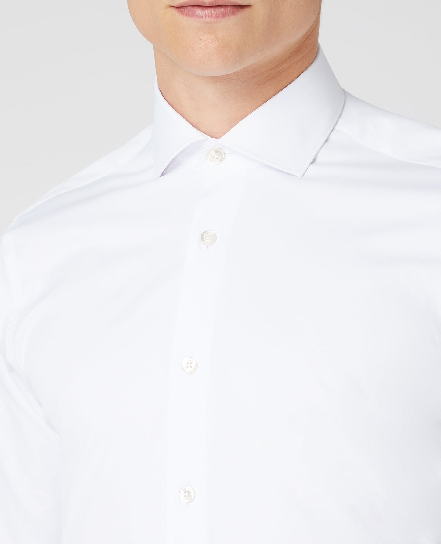 Man wearing a white Tapered Fit Cotton Stretch Shirt