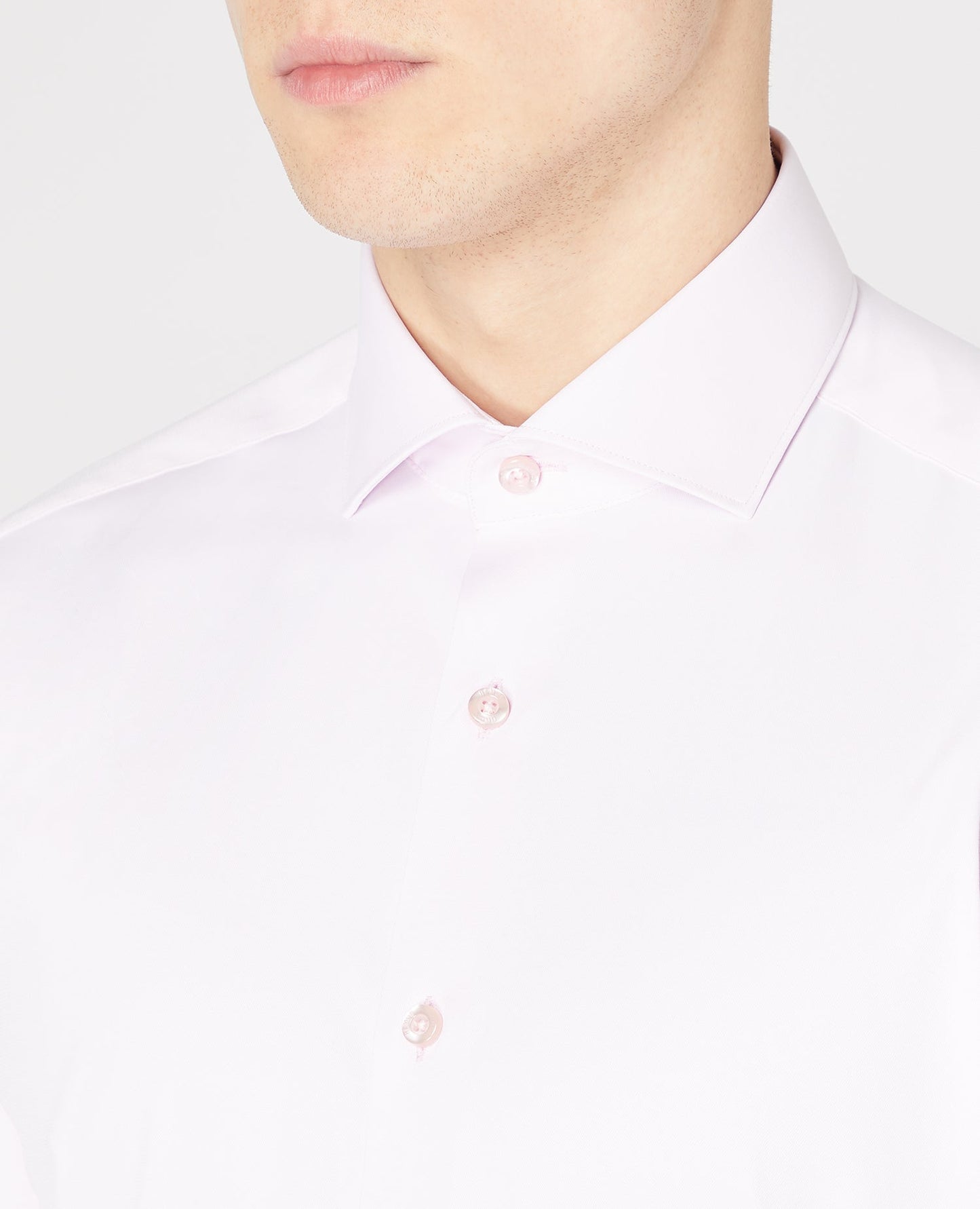 Man wearing a pink Tapered Fit Cotton Stretch Shirt