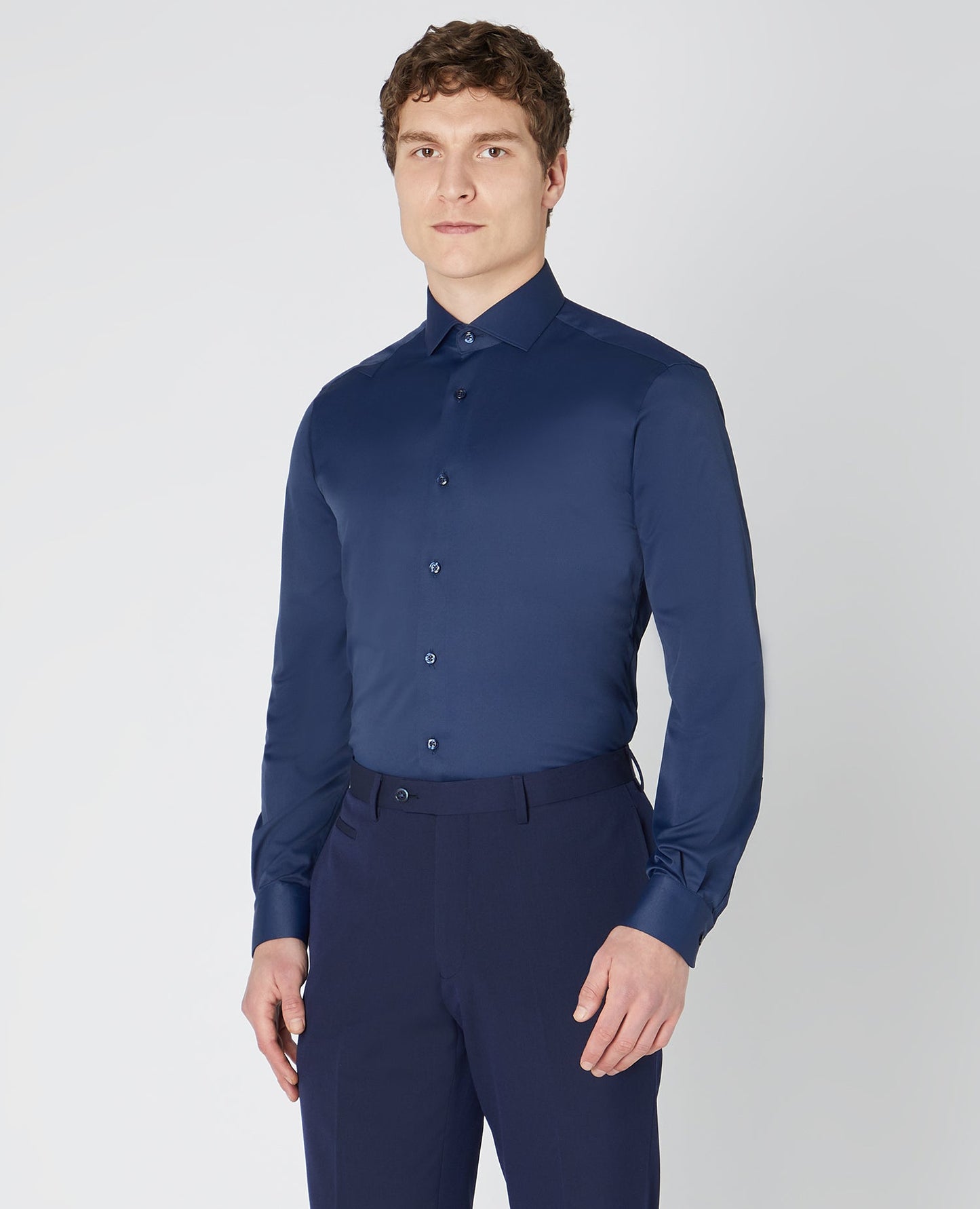 Man wearing a navy Tapered Fit Cotton Stretch Shirt
