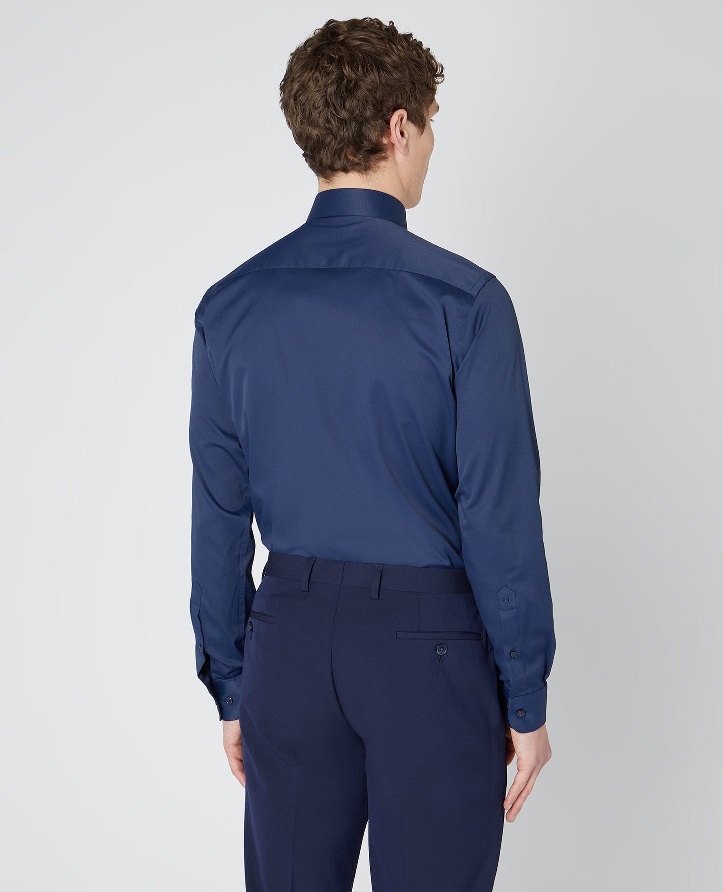 Man wearing a navy Tapered Fit Cotton Stretch Shirt