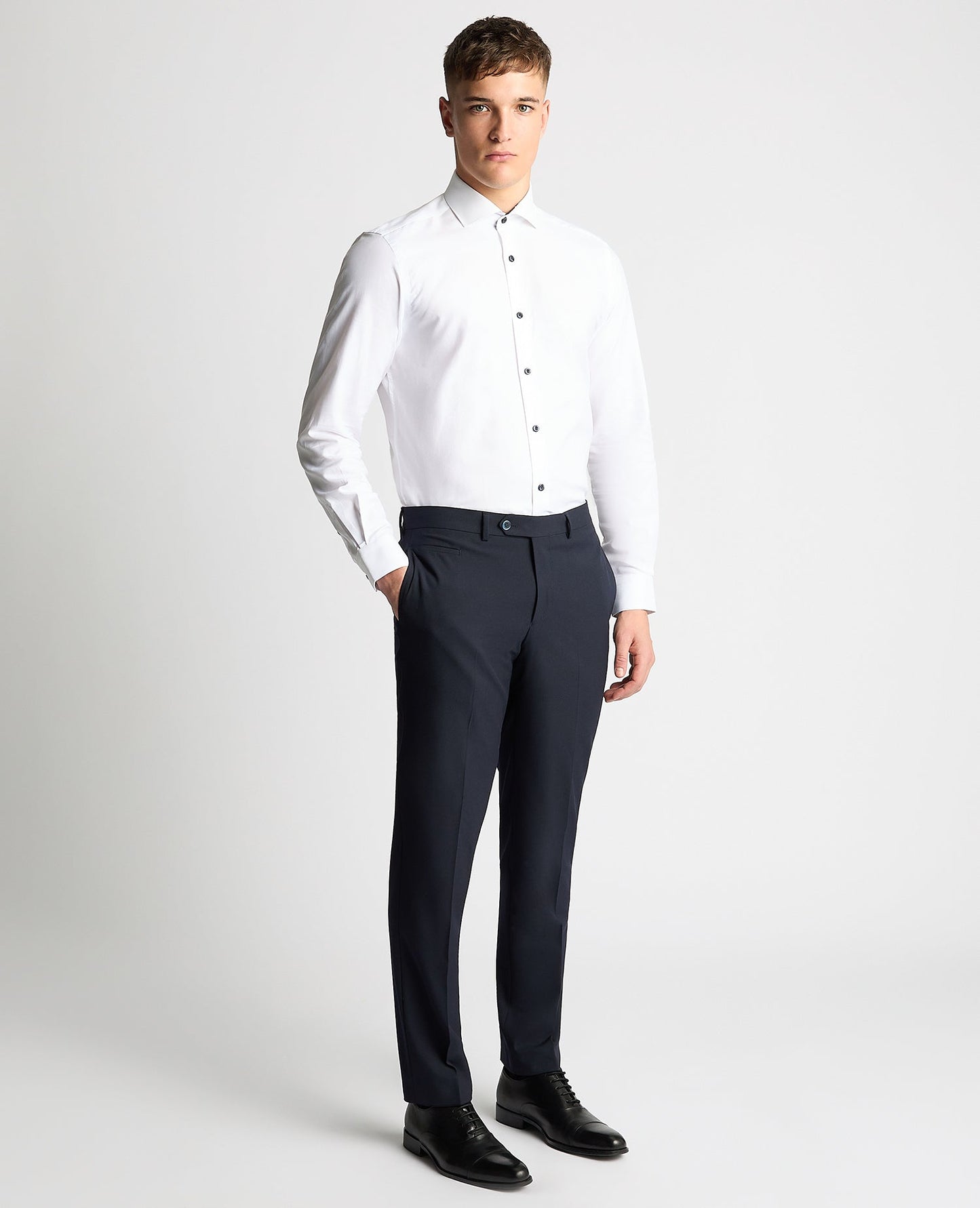 Man wearing a white Tapered Fit Jacquard Cotton Shirt