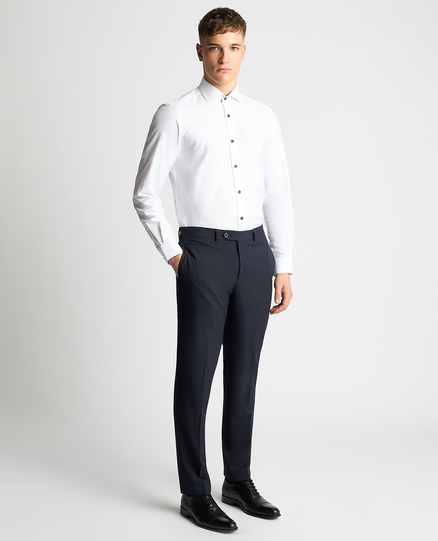 Man wearing a white Tapered Fit Jacquard Cotton Shirt