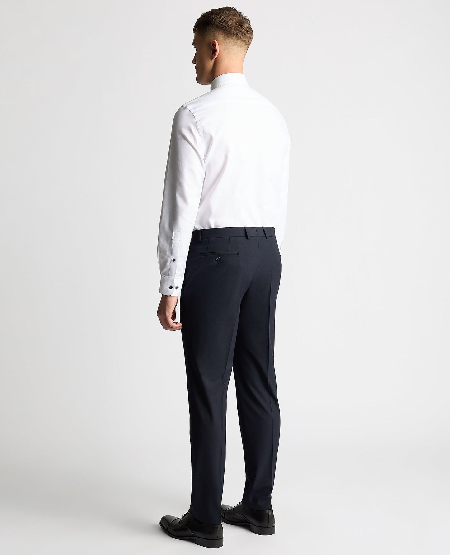 Man wearing a white Tapered Fit Jacquard Cotton Shirt