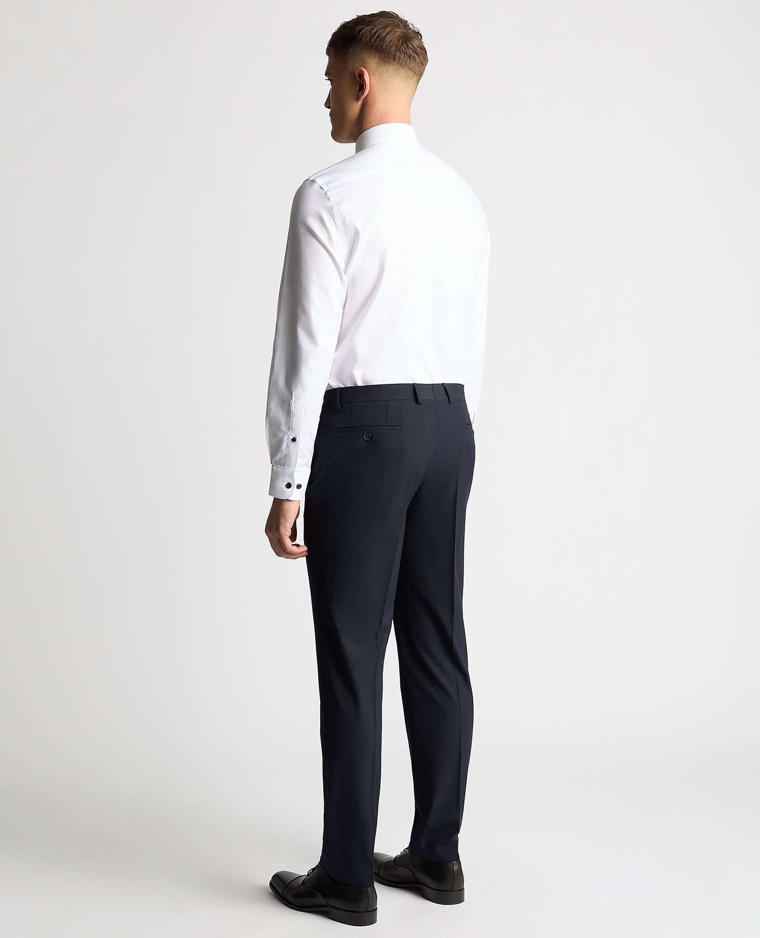 Man wearing a white Tapered Fit Jacquard Cotton Shirt