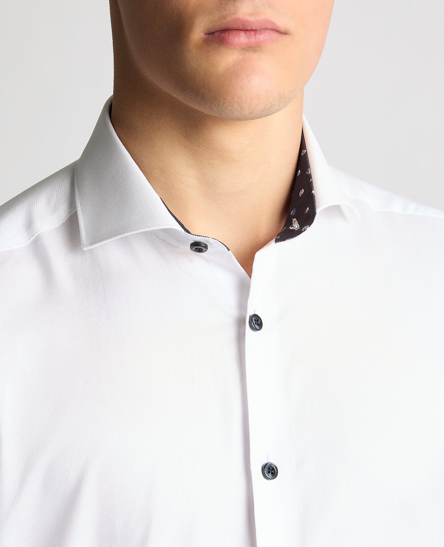 Man wearing a white Tapered Fit Jacquard Cotton Shirt