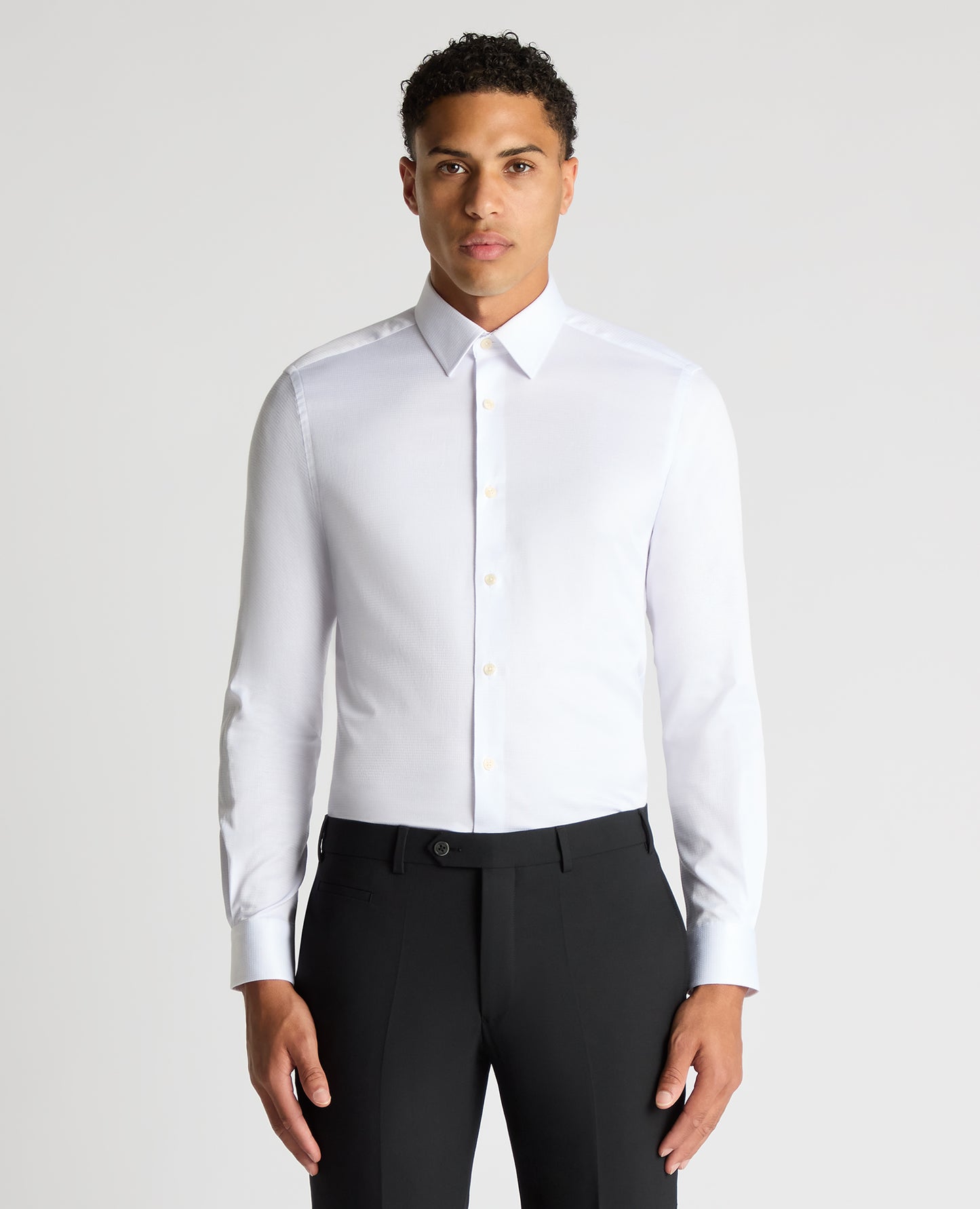 Man wearing a white Slim Fit Cotton Stretch Jacquard Shirt