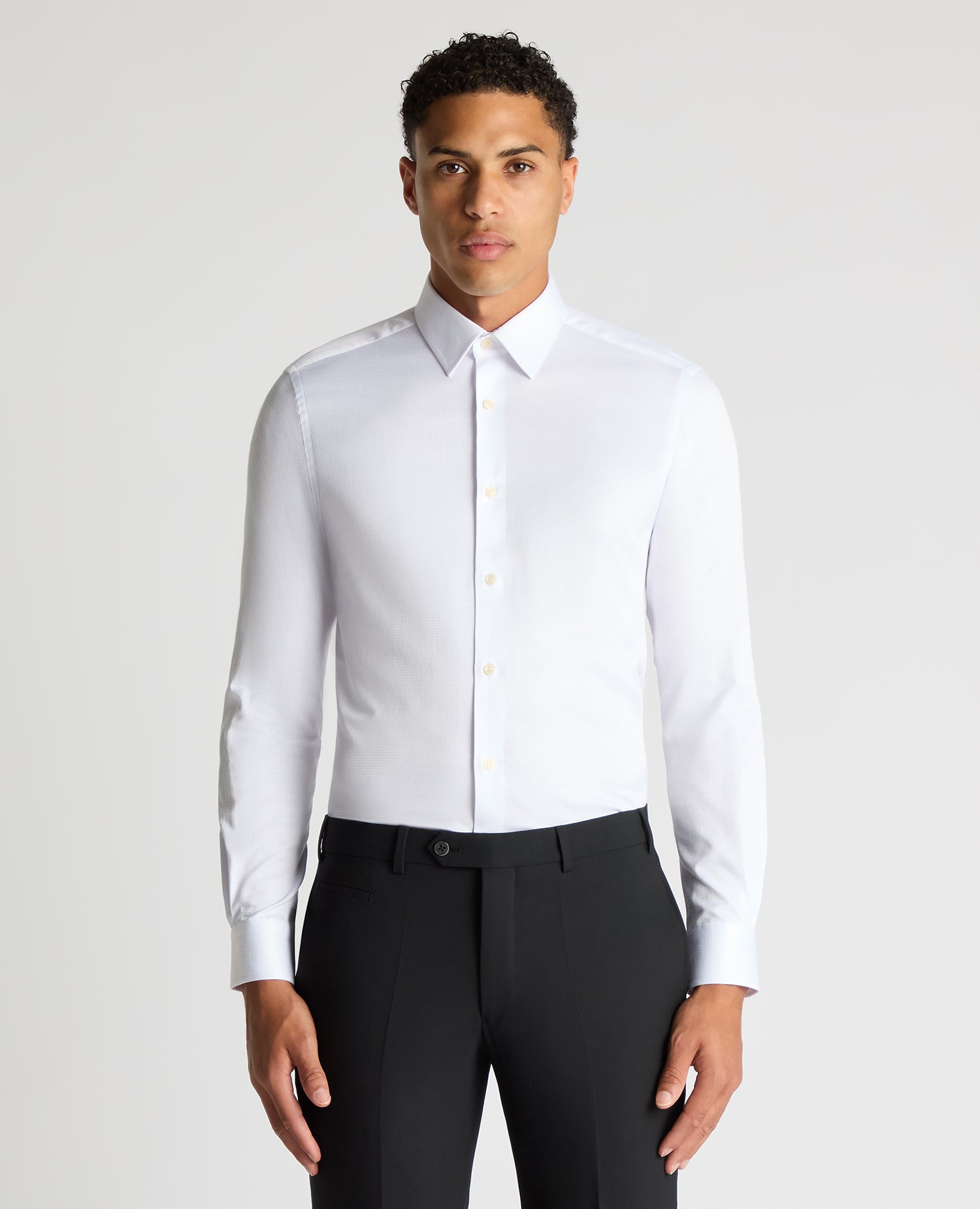 Man wearing a white Slim Fit Cotton Stretch Jacquard Shirt