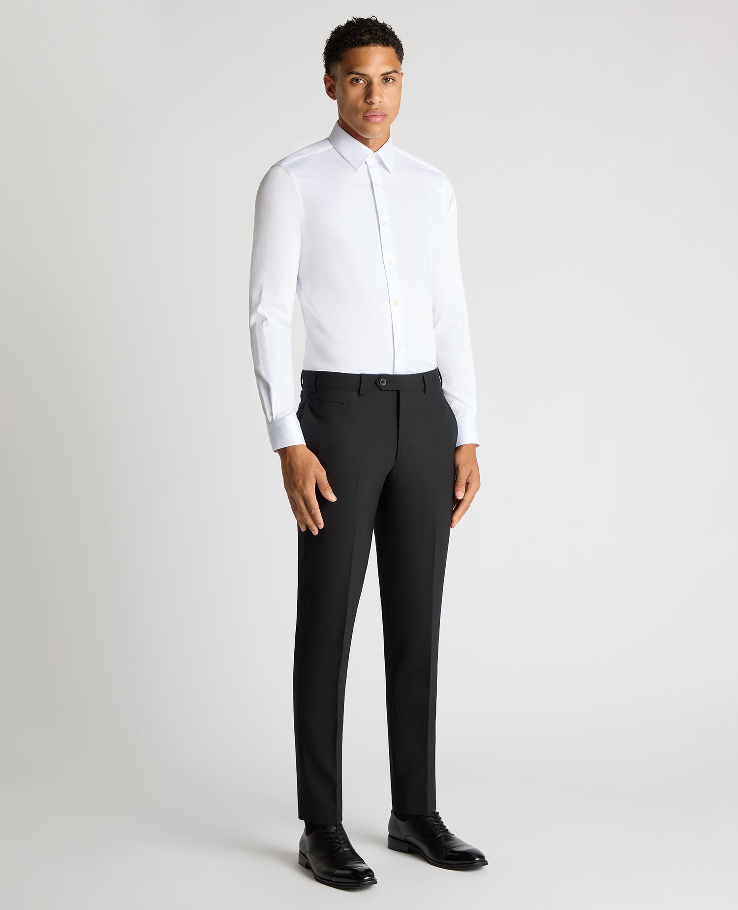 Man wearing a white Slim Fit Cotton Stretch Jacquard Shirt