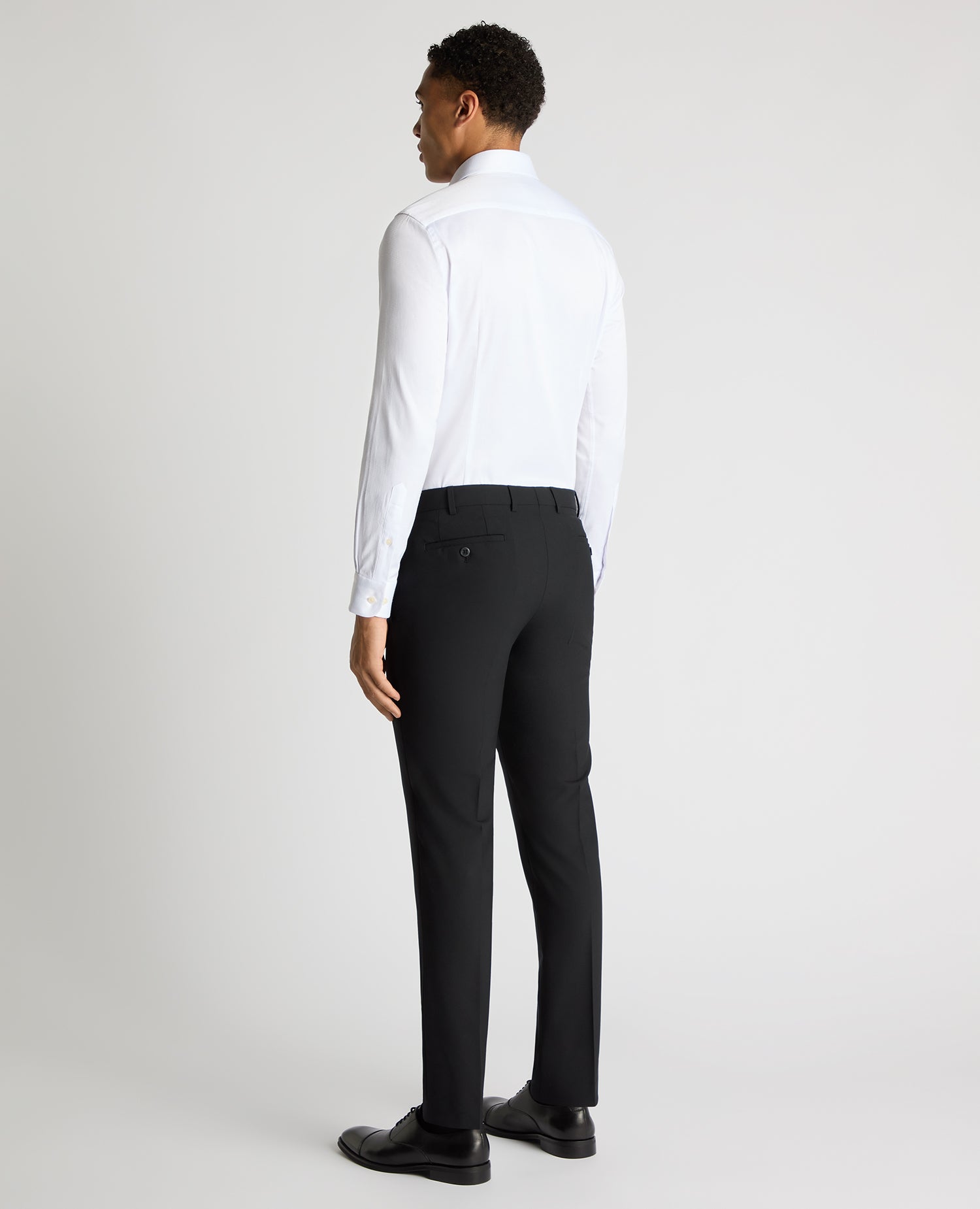 Man wearing a white Slim Fit Cotton Stretch Jacquard Shirt