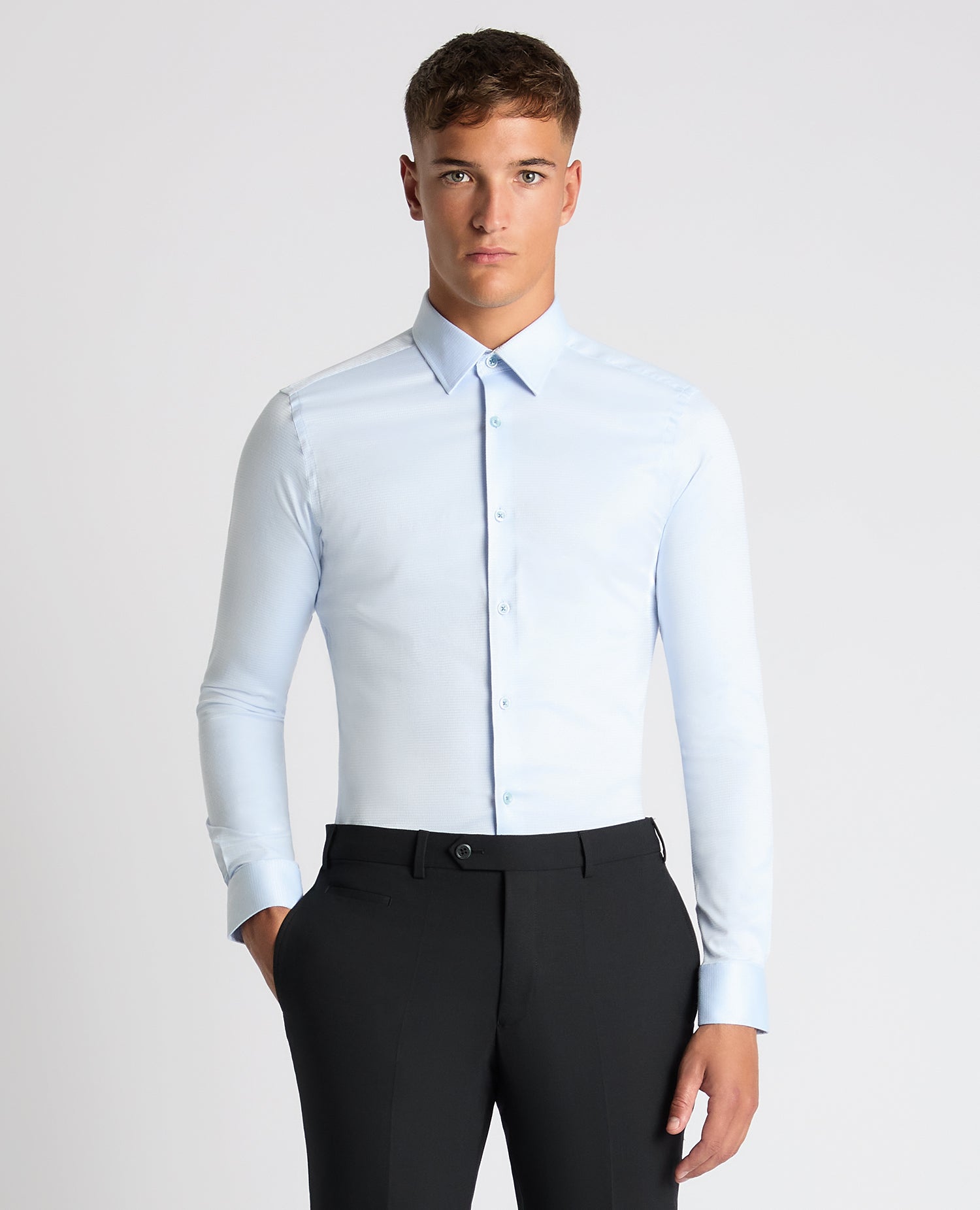Man wearing a blue Slim Fit Cotton Stretch Jacquard Shirt