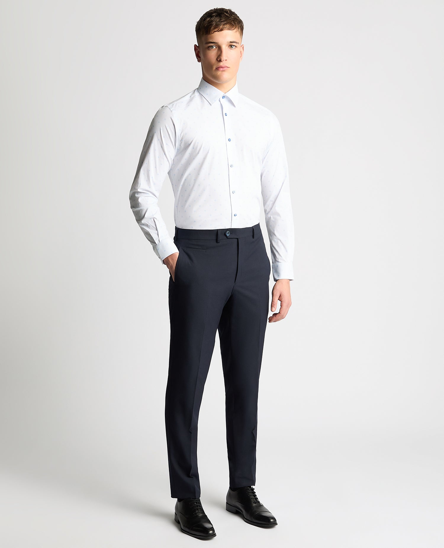 Man wearing a blue Tapered Fit Cotton Stretch Shirt