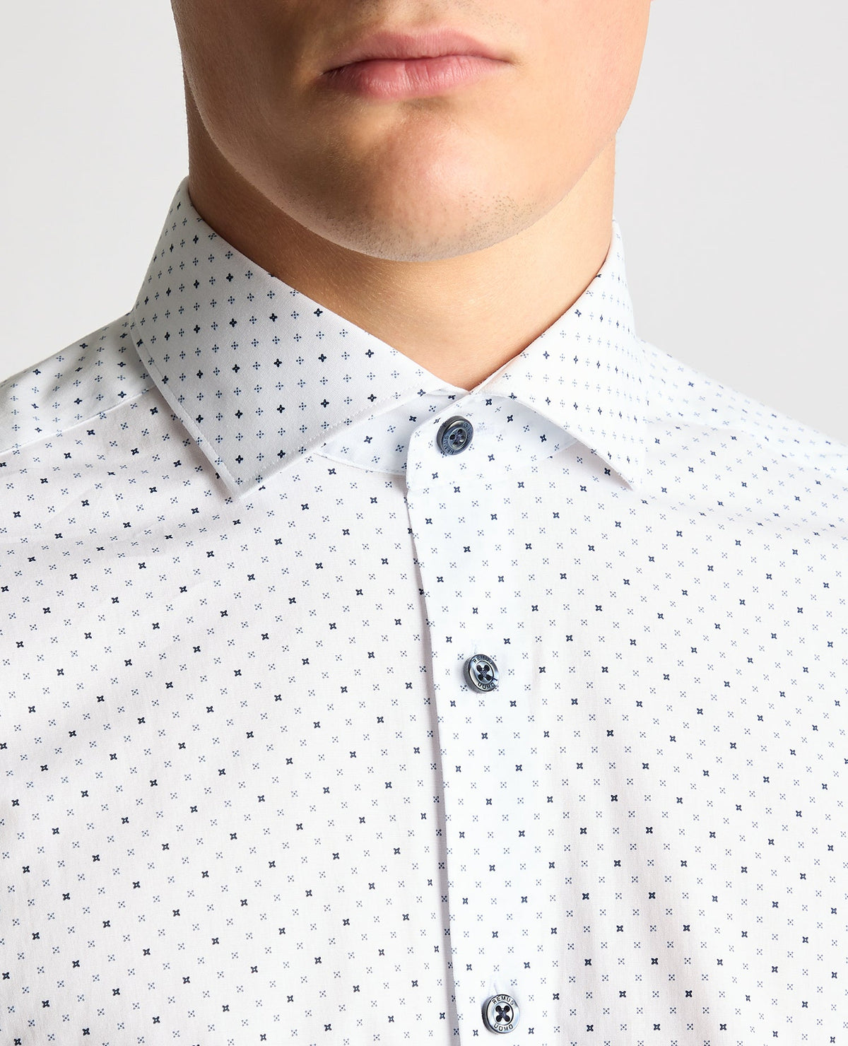 Man wearing a navy Tapered Fit Print Cotton Stretch Shirt