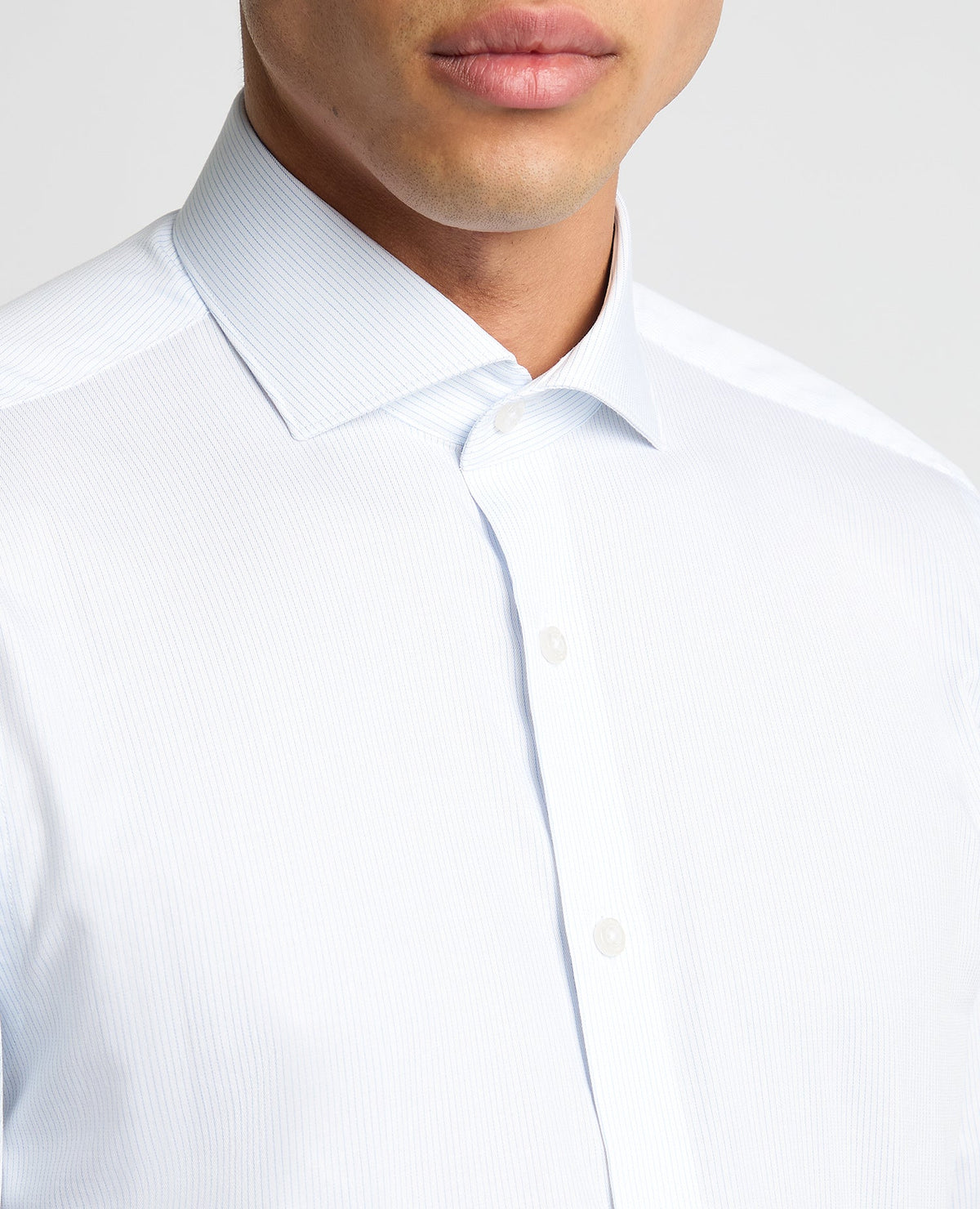 Man wearing a blue Tapered Fit Pinstripe Cotton Shirt