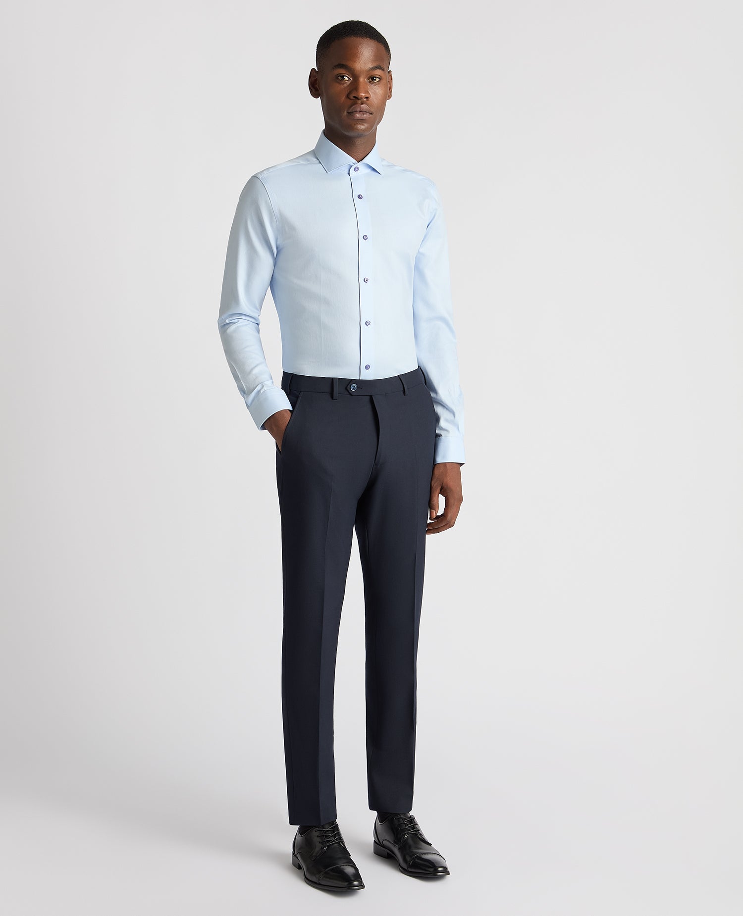 Man wearing a blue Slim Fit Cotton Twill Shirt