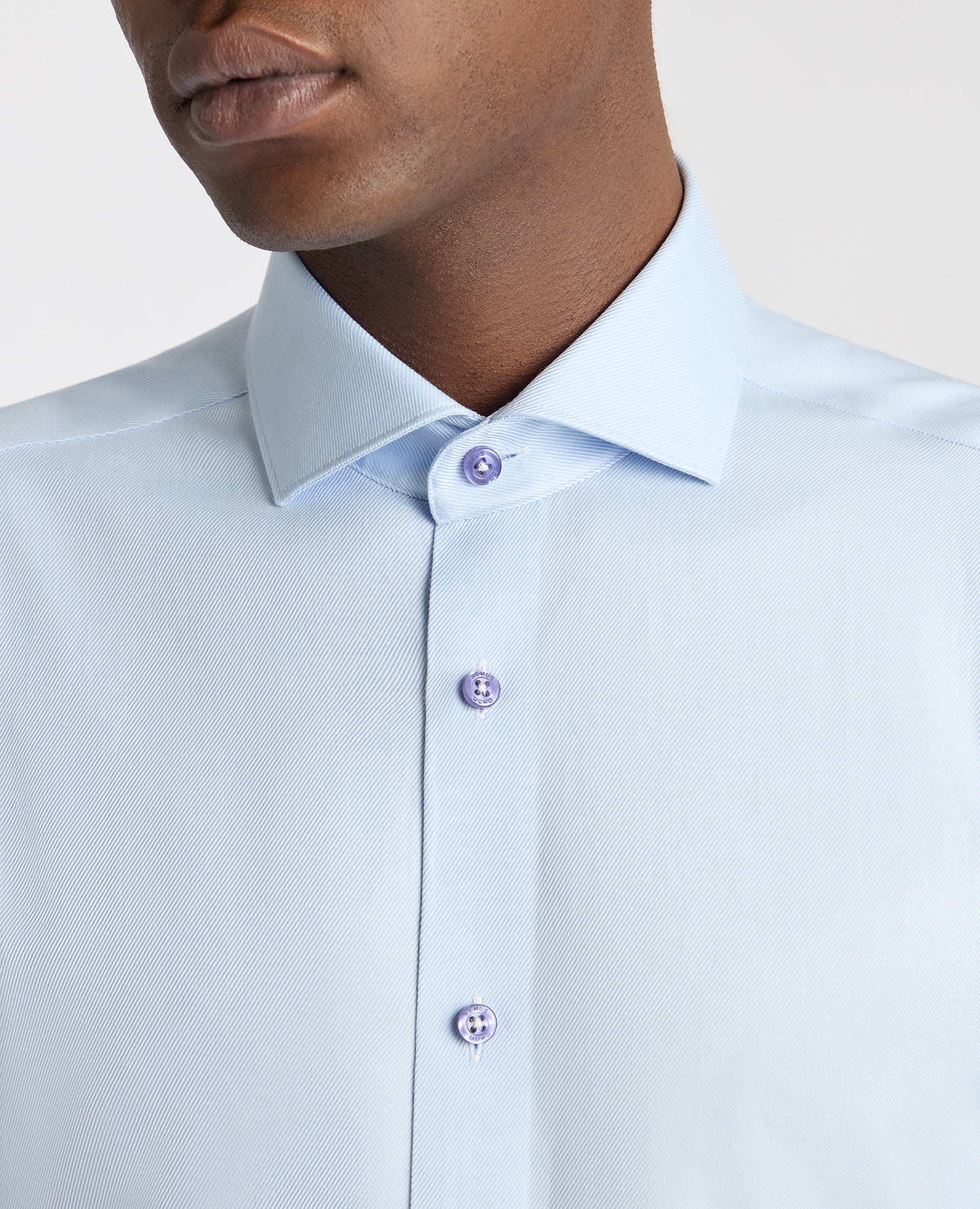 Man wearing a blue Slim Fit Cotton Twill Shirt